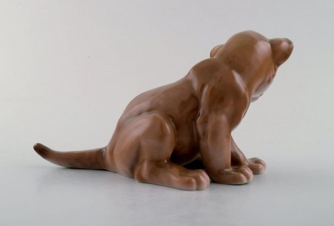 Danish B & G / Bing & Grondahl, Sitting lion cub in porcelain For Sale