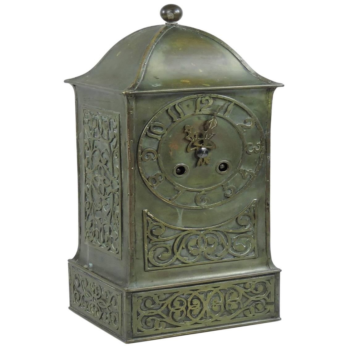B G H, Attri an Arts & Crafts Brass Mantel Clock with Stylised Floral Chasing For Sale