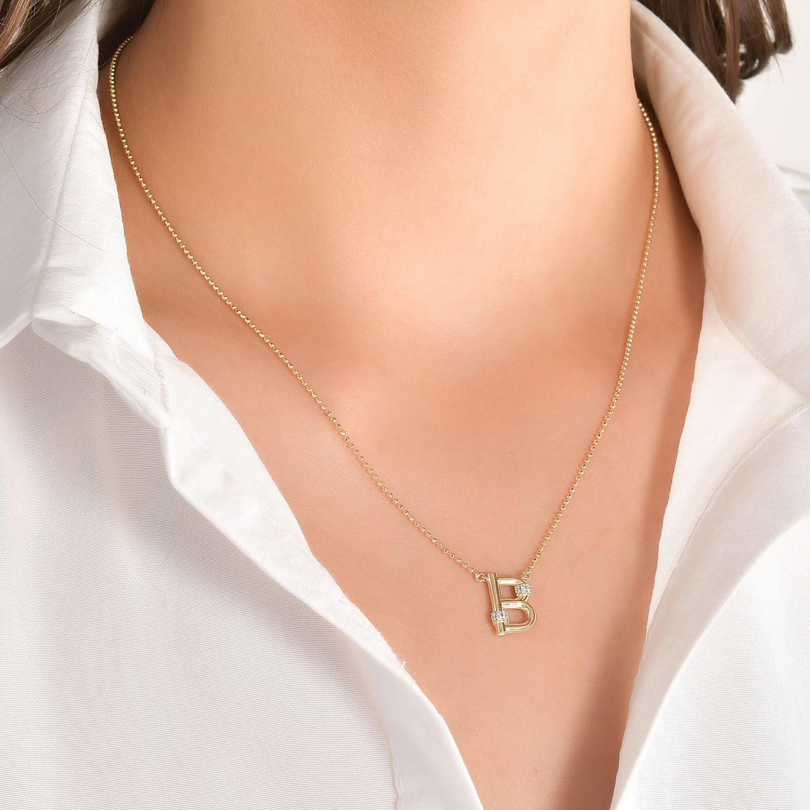 Sophisticated Diamond B Letter Charm Featuring Brilliant-cut Diamonds and a 14K Yellow Gold

Round Diamond: 0,08ct	
Color: E	
Clairty: SI
14K Gold: 4.20Gr.