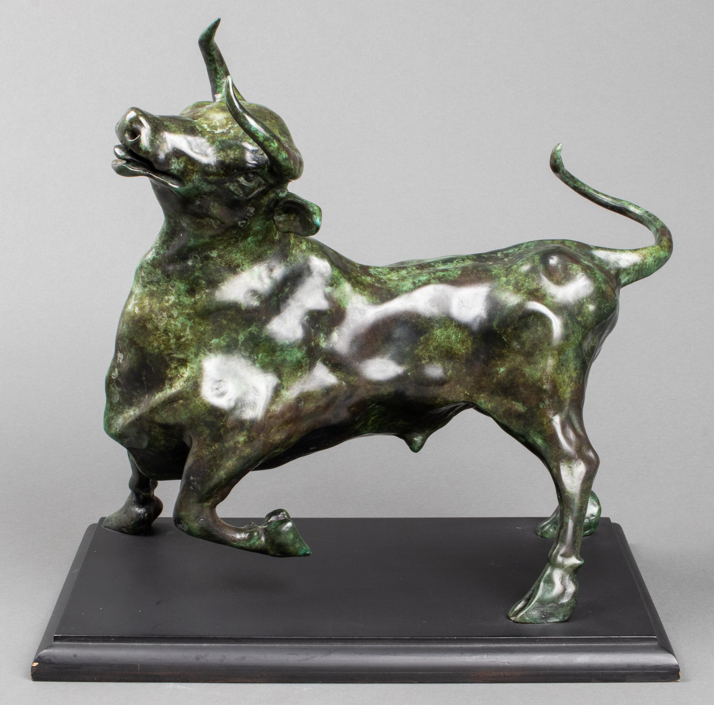 Modern bronze bull sculpture with verdigris patina, depicting animated bull in stride, signed 