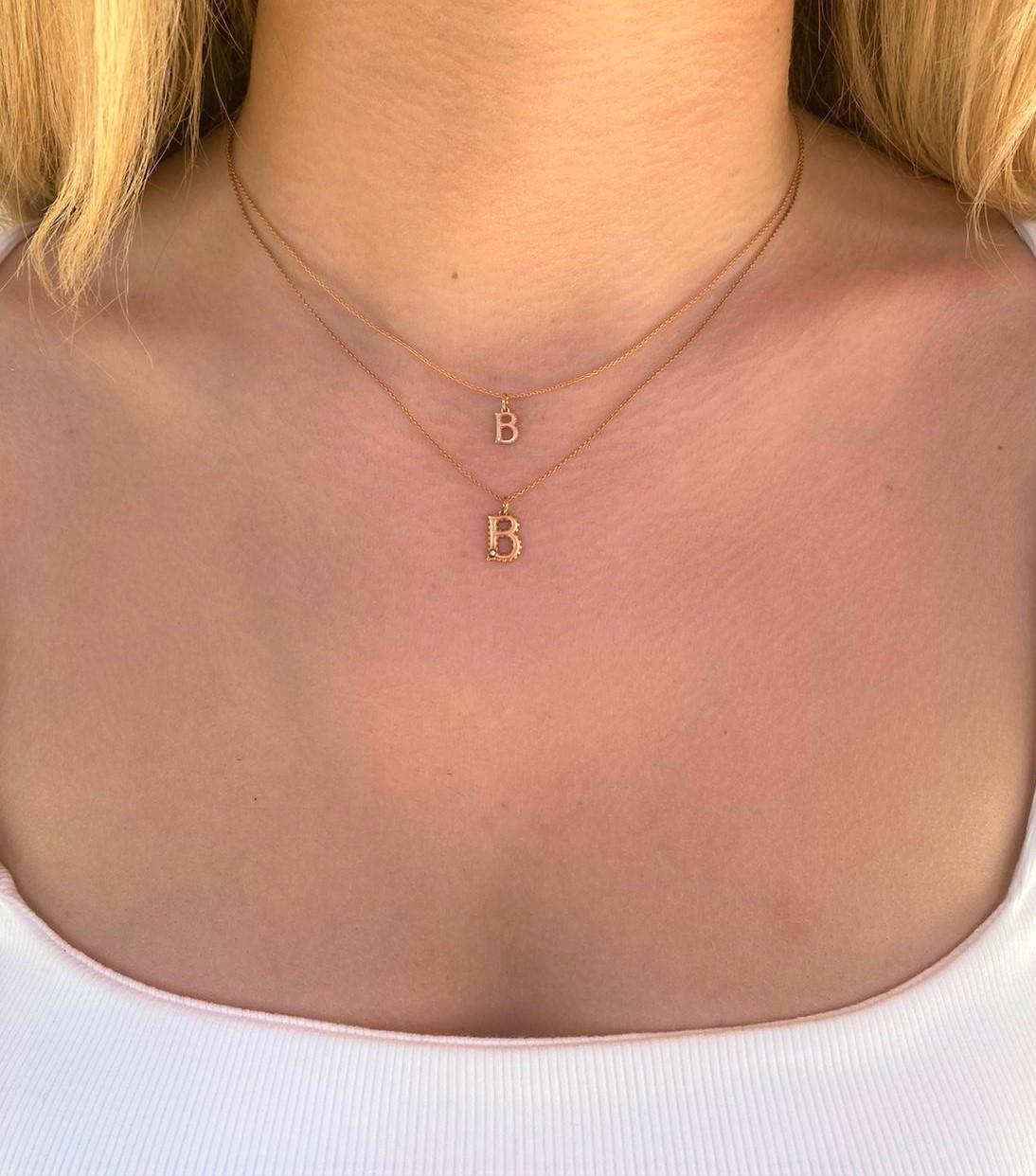 B small necklace in 14k rose gold with 0.01ct white diamond by selda jewellery

Additional Information:-
Collection: Letter collection
14K Rose gold
0.01ct White diamond
Pendant height 0.7cm
Chain length 44cm