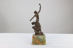 B V Fernandez. An Art Deco bronze figure on an onyx base