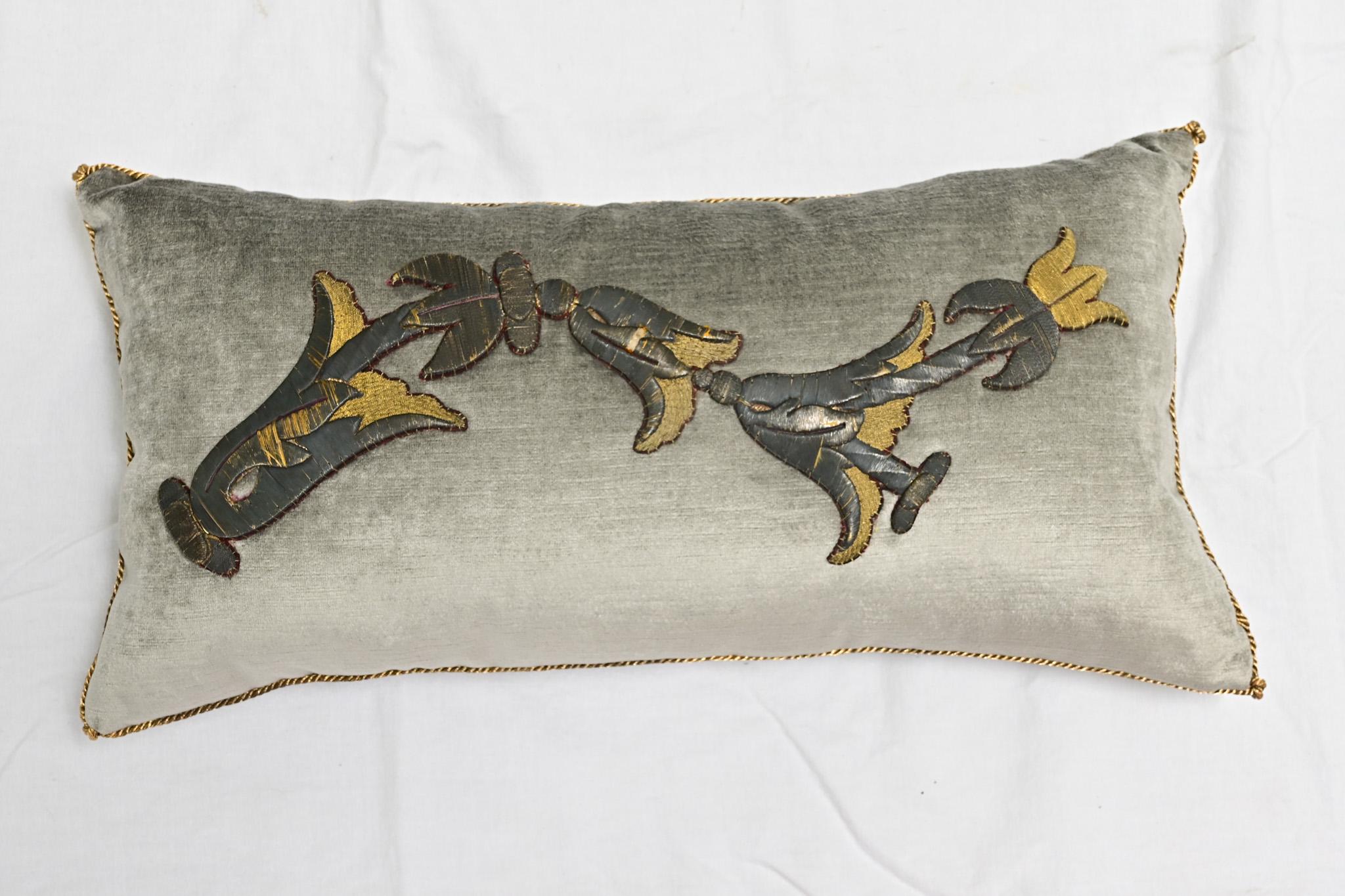 A beautiful single velvet pillow. Hand-trimmed and features vintage metallic gold cording, knotted in the corners. Designed by Rebecca Vizard for B. Viz Design, this down filled pillow has thickly raised, antique European dark bronze and gold