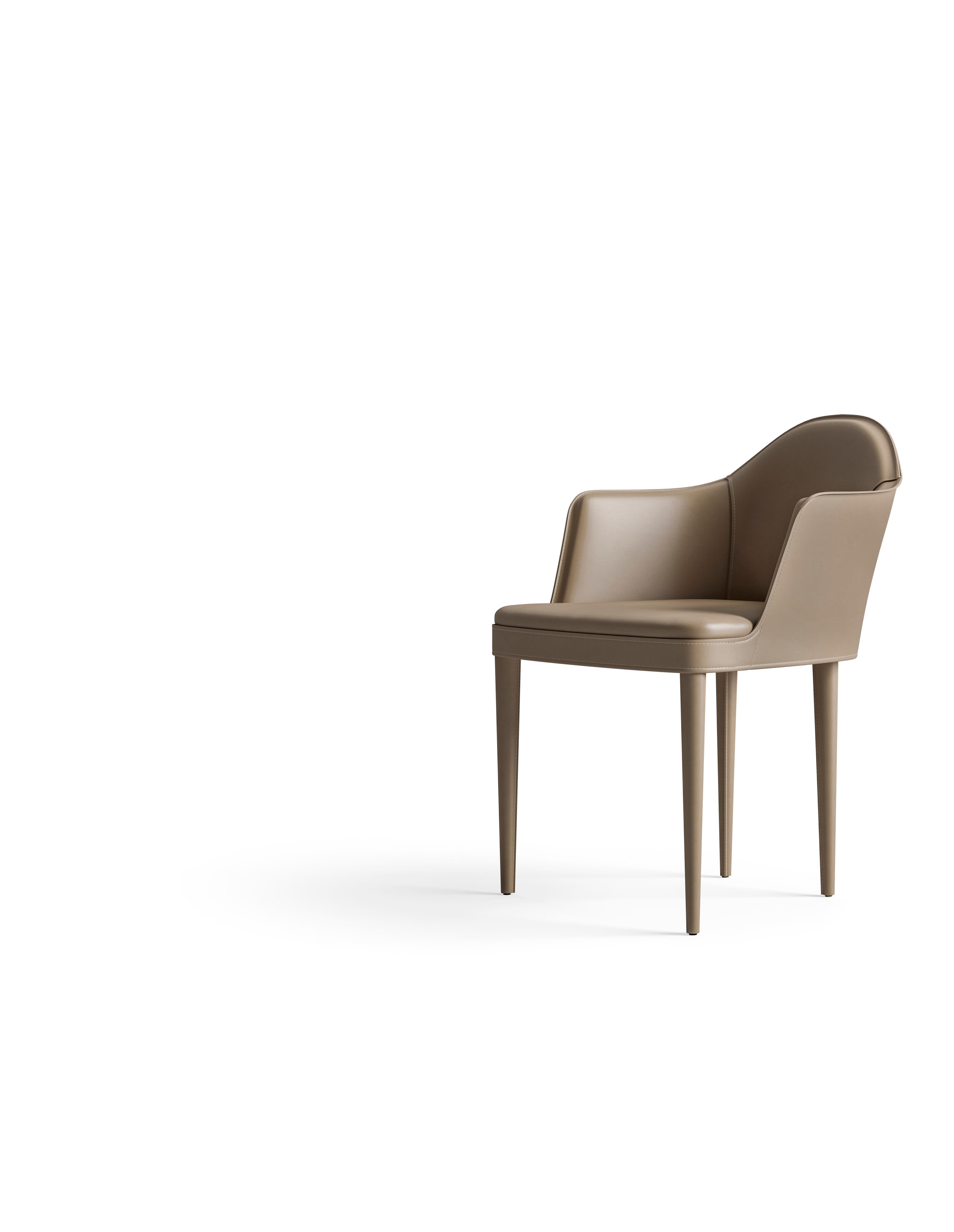 A chair entirely upholstered in saddle leather, offering a sleek and sophisticated look. The smooth, supple saddle leather envelops the entire chair, creating a seamless and elegant appearance. The rich texture of the saddle leather adds depth and