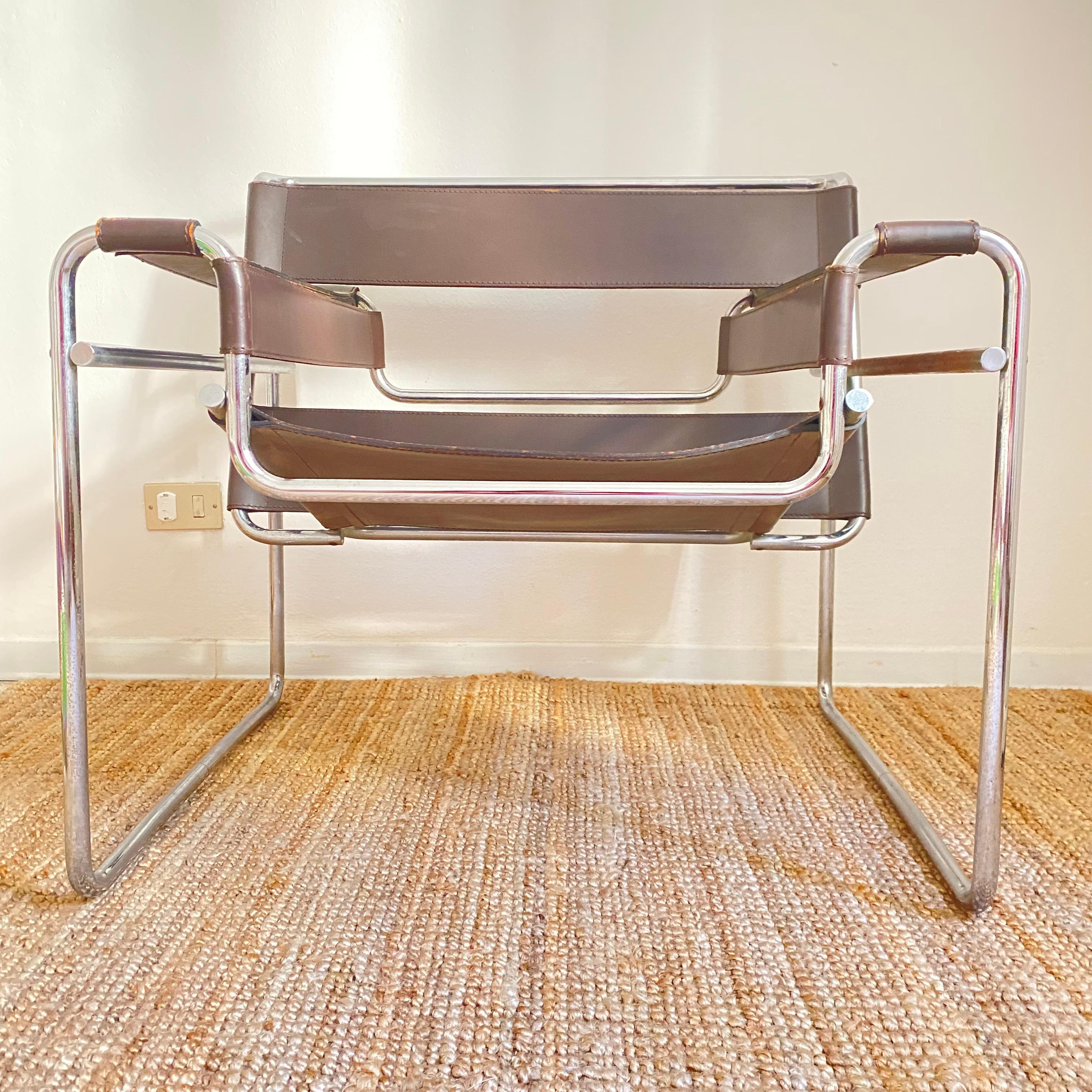 Iconic Wassily armchair model B3 in brown leather by Marcel Breuer produced by Gavina in the 1970s.

The B 3 chair became a mass product in the sixties after Dino Gavina in 1962, after meeting the Hungarian designer in New York, had convinced him