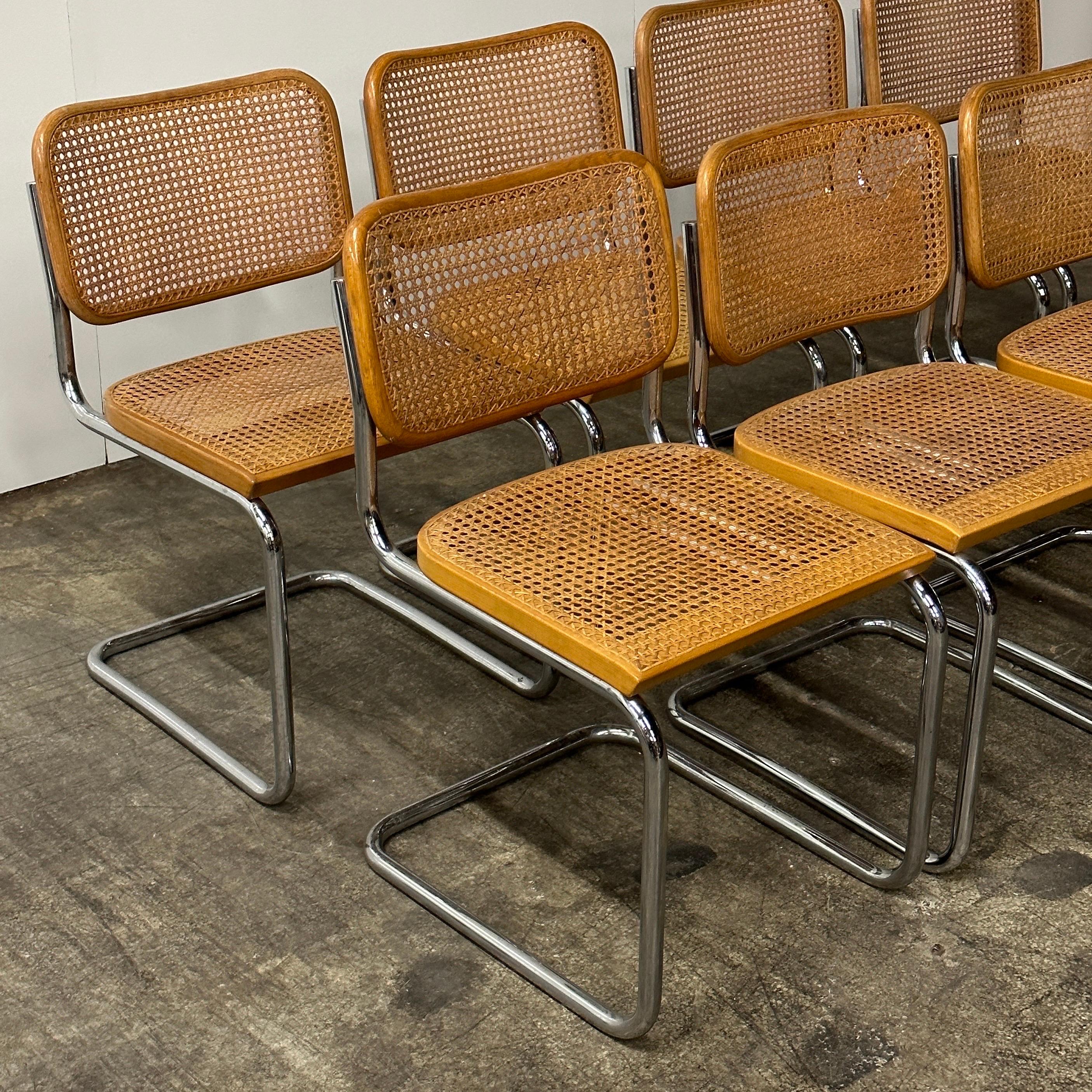 c. 1960s. Price is for the set. Contact us if you’d like to purchase a single item. These Cesca chairs are an original example of the armless B32 chair by Marcel Breuer. They are extremely rare in this condition, especially for a set of eight. These
