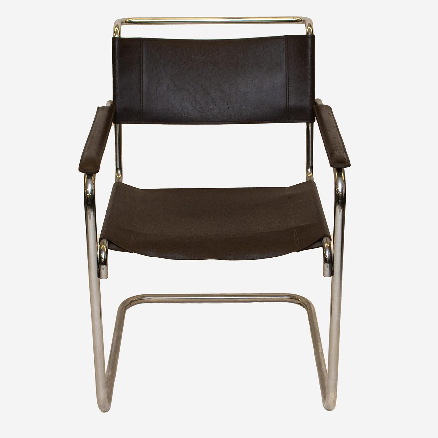 The B34 chair was designed by Marcel Breuer between 1920 and 1949 for Thonet in Germany. This iconic Bauhaus design features a steel tubular frame, a deep brown saddle leather seat, backrest, and armrest covers. This item is offered as a pair in