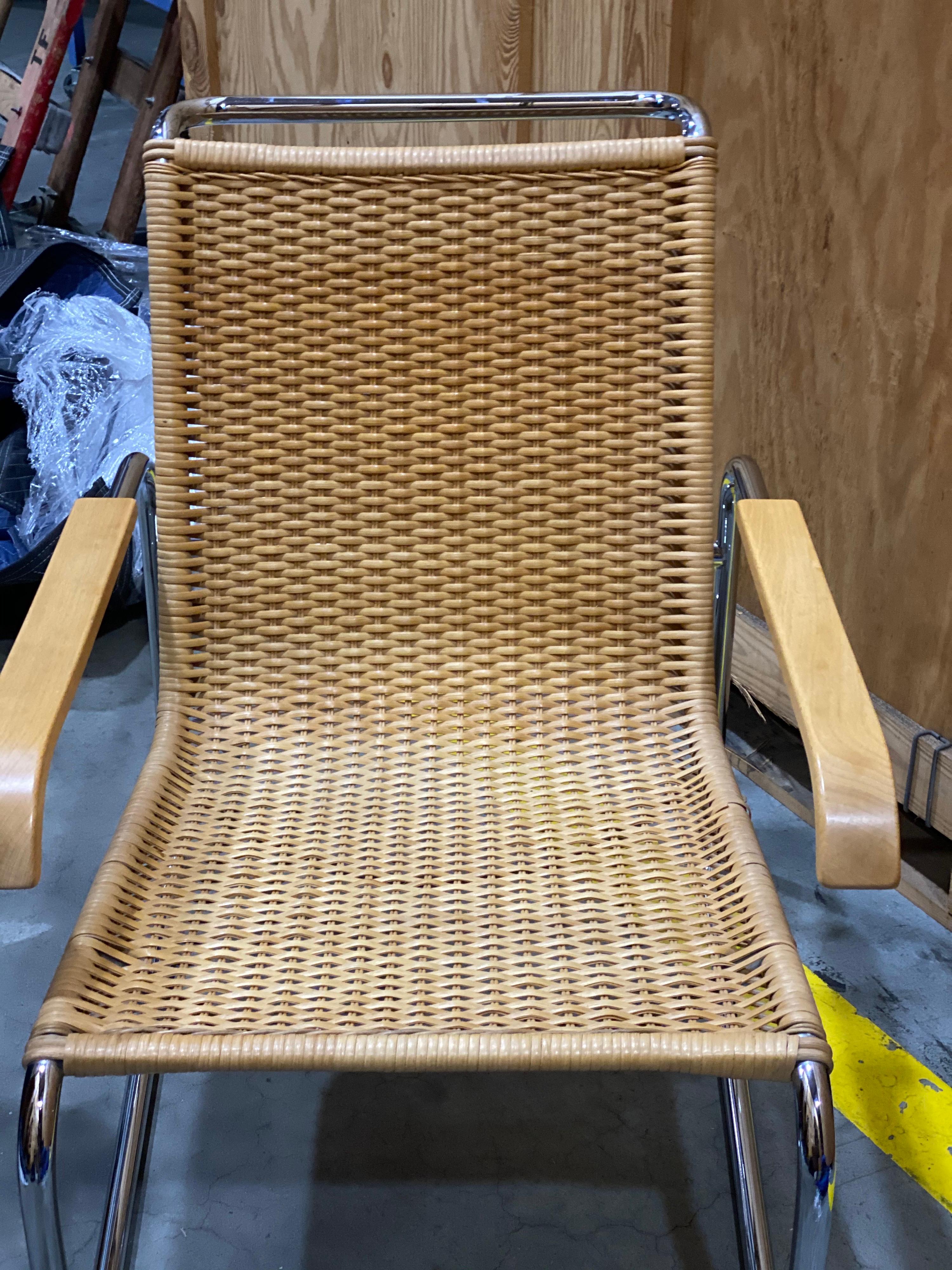 Chromed metal and rattan B35 lounge chair with wooden armrests by Marcel Breuer for Thonet., Re-edition by Thonet 1970s. Mohair cushions made for chair. Good overall condition. Water mark on arm. One area loose on rattan.

Measures: 31.25