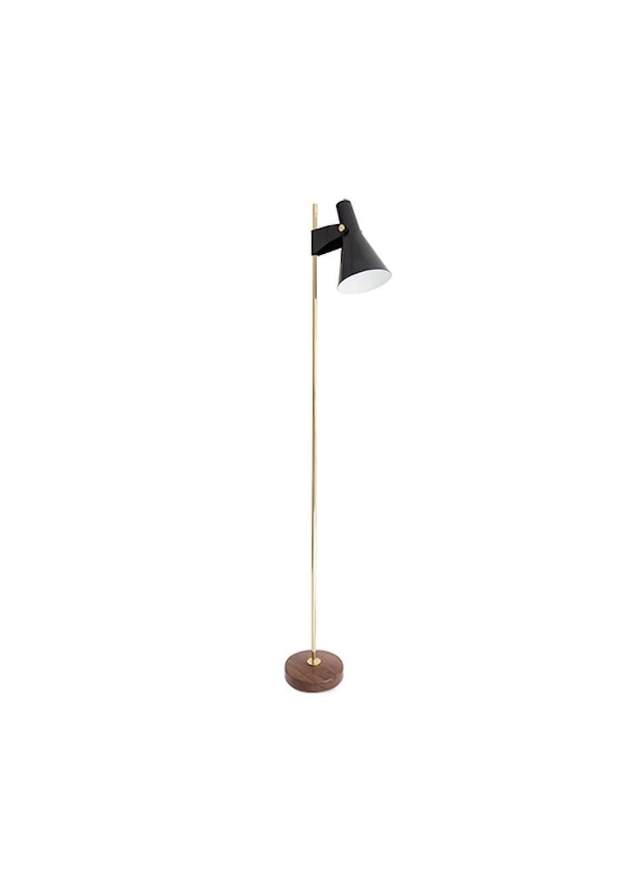 This large floor lamp is designed by René-Jean Caillette as an extension of the wall lamp B3, with a thin brass tube and round base in solid wood. Available in two sizes, this lamp is ideal next to a sofa, as a reading lamp or as ambient lighting.