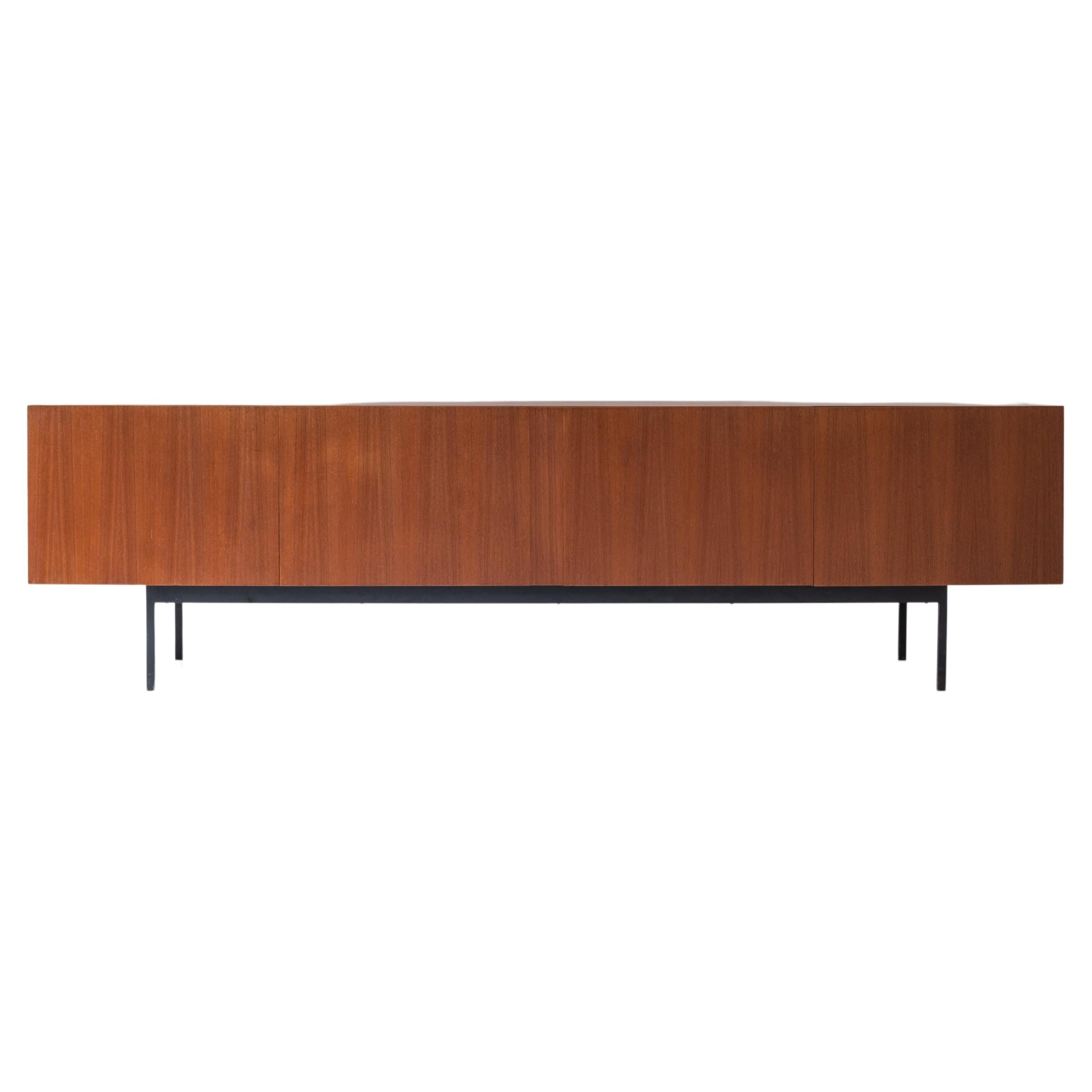 Minimalist ‘B40’ sideboard by Swiss architect Dieter Waeckerlin for Behr Möbel, Germany 1958. This sideboard is made out of teak and has a black lacquered steel frame. The inside is finished with maple wood removable trays and a bottle holder.