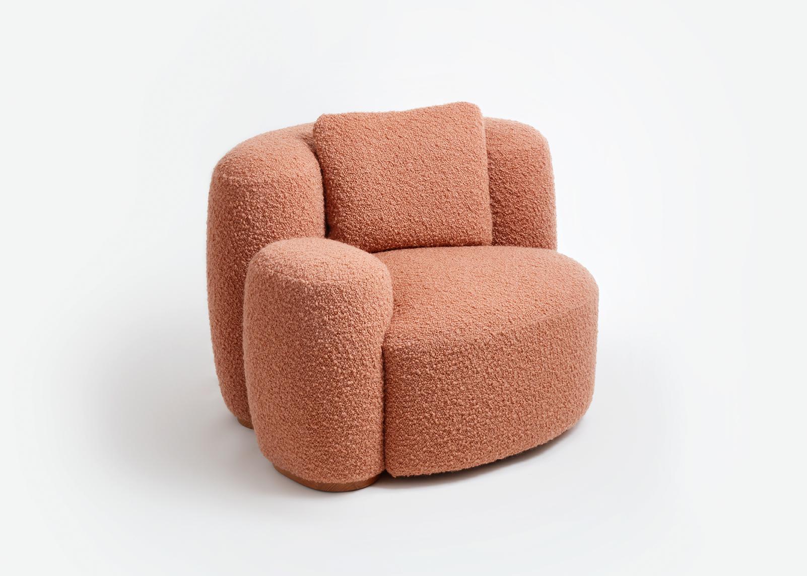 Baba easy chair by Gisbert Pöppler
Dimensions: H 74 (SH43) x W 115 x D 93 cm 
Materials: Upholstered wooden frame, teak footings

Like a friend that wants to cuddle, Baba is an upholstered easy chair for lounging in complete comfort. The