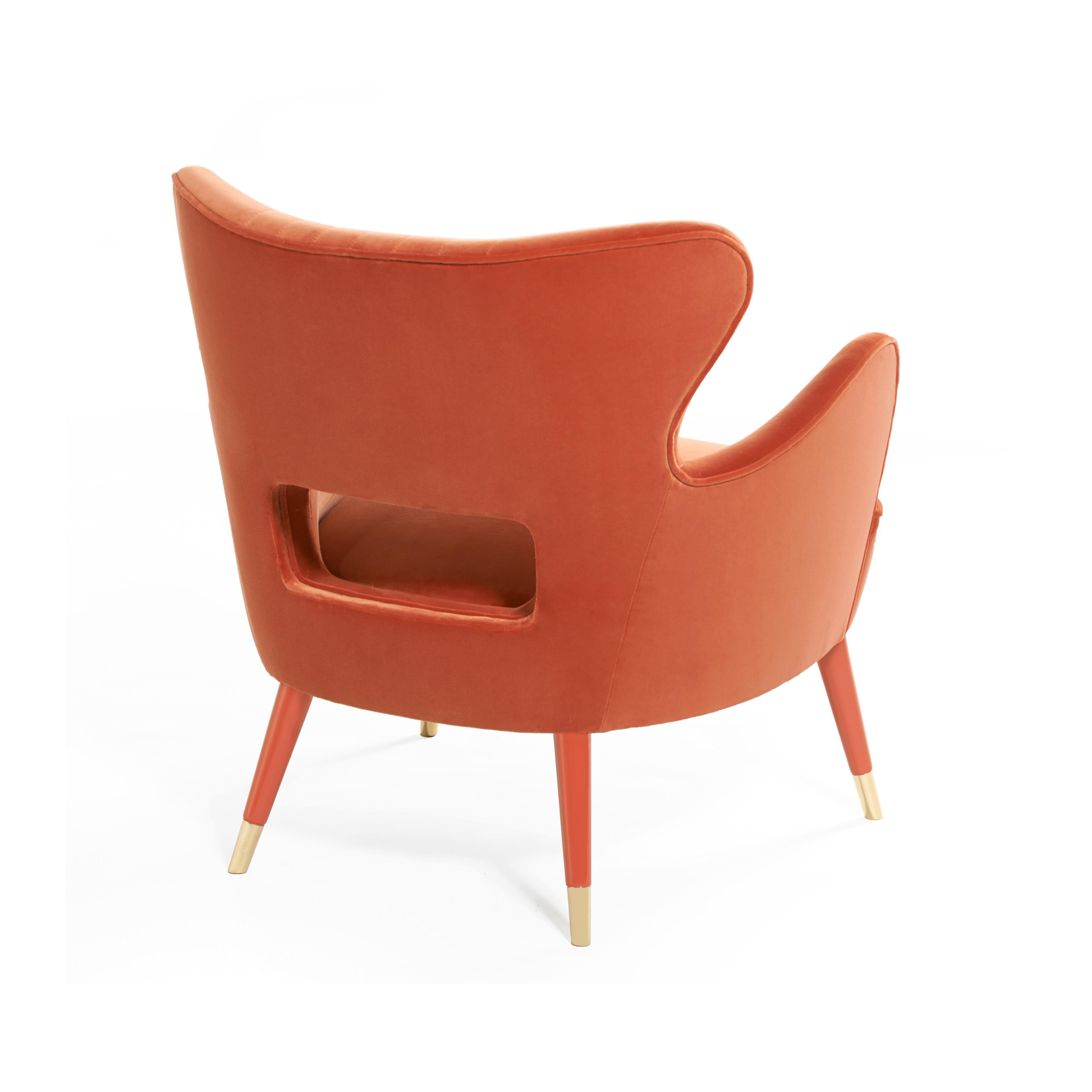 This armchair holds the graciousness of modern mid-century design, with irresistible contemporary appeal. The haute couture upholstery and detailed seams, lacquered legs and outline piping underscore its voluptuous shape. The curvy lines on the Babe