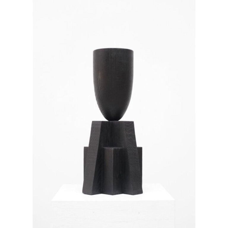 Babel vase by Arno Declercq
Dimensions: W 32 x L 32 x H 65 cm 
Materials: Burned and waxed oak

Arno Declercq
Belgian designer and art dealer who makes bespoke objects with passion for design, atmosphere, history and craft. Arno grew up in a