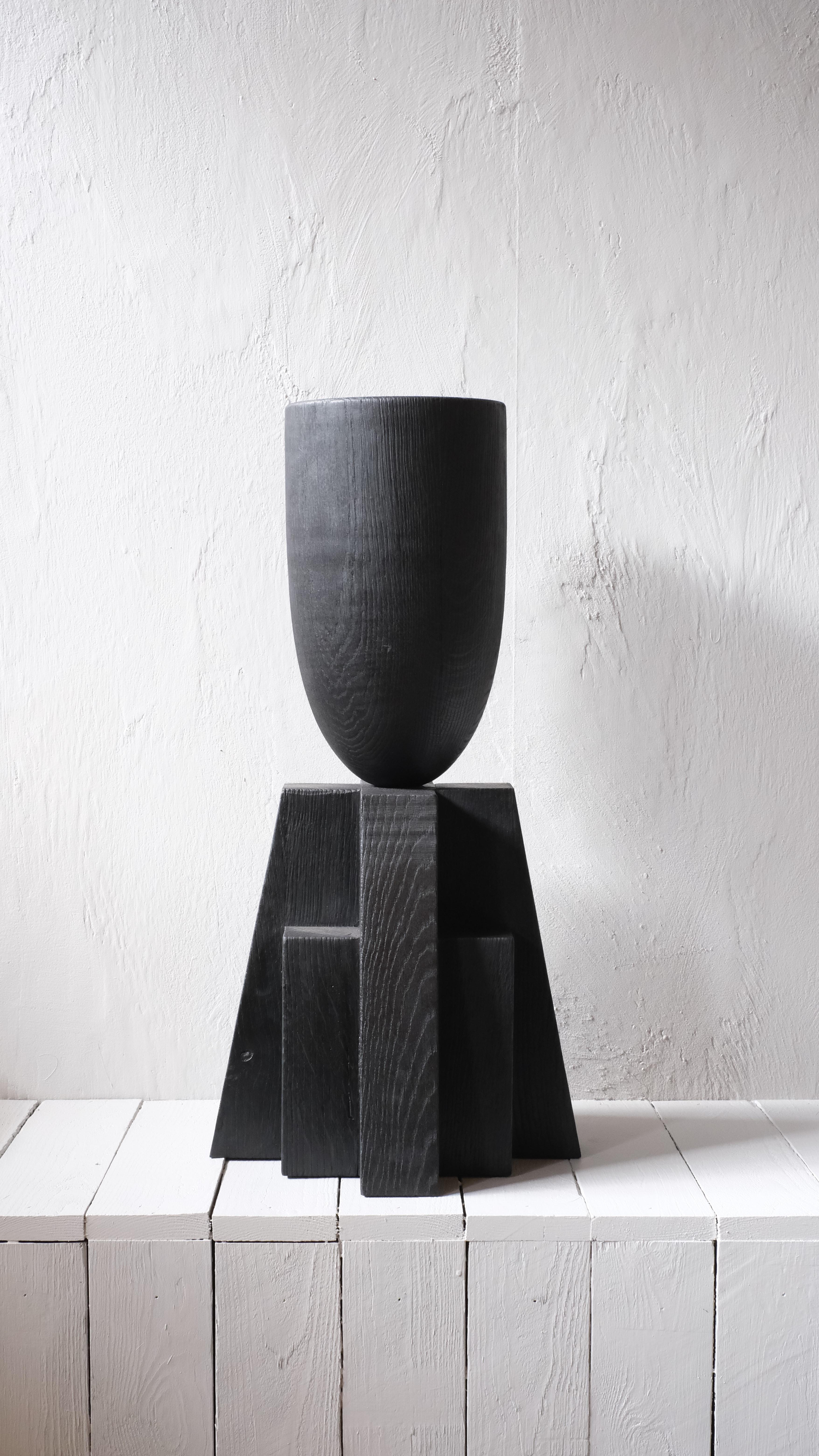 Babel vase by Arno Declercq
Dimensions: W 32 x L 32 x H 65 cm 
Materials: Burned and waxed oak

Arno Declercq
Belgian designer and art dealer who makes bespoke objects with passion for design, atmosphere, history and craft. Arno grew up in a