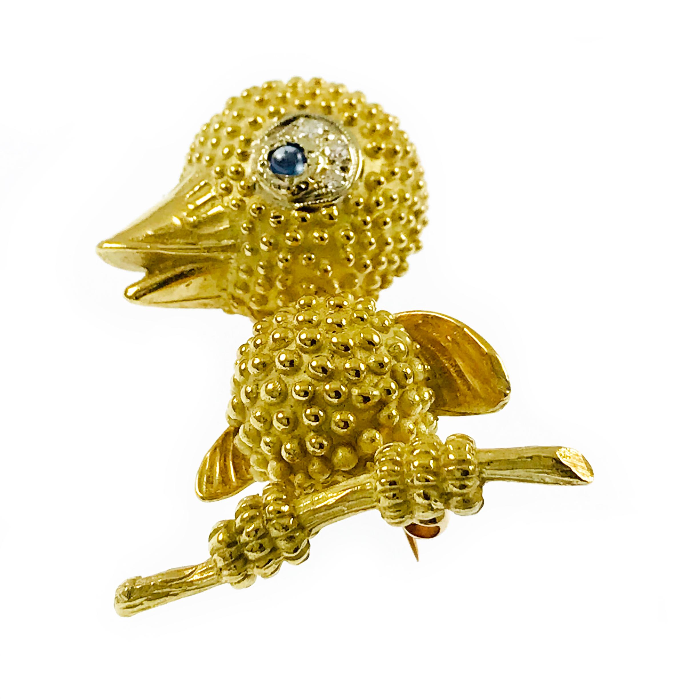 18k Yellow Gold Diamond Sapphire Brooch. This sweet little baby bird will capture your heart, significantly textured body, wings, feet and branch. The eye has a milgrain outline and three round 1.56mm single-cut diamonds set in white gold with a