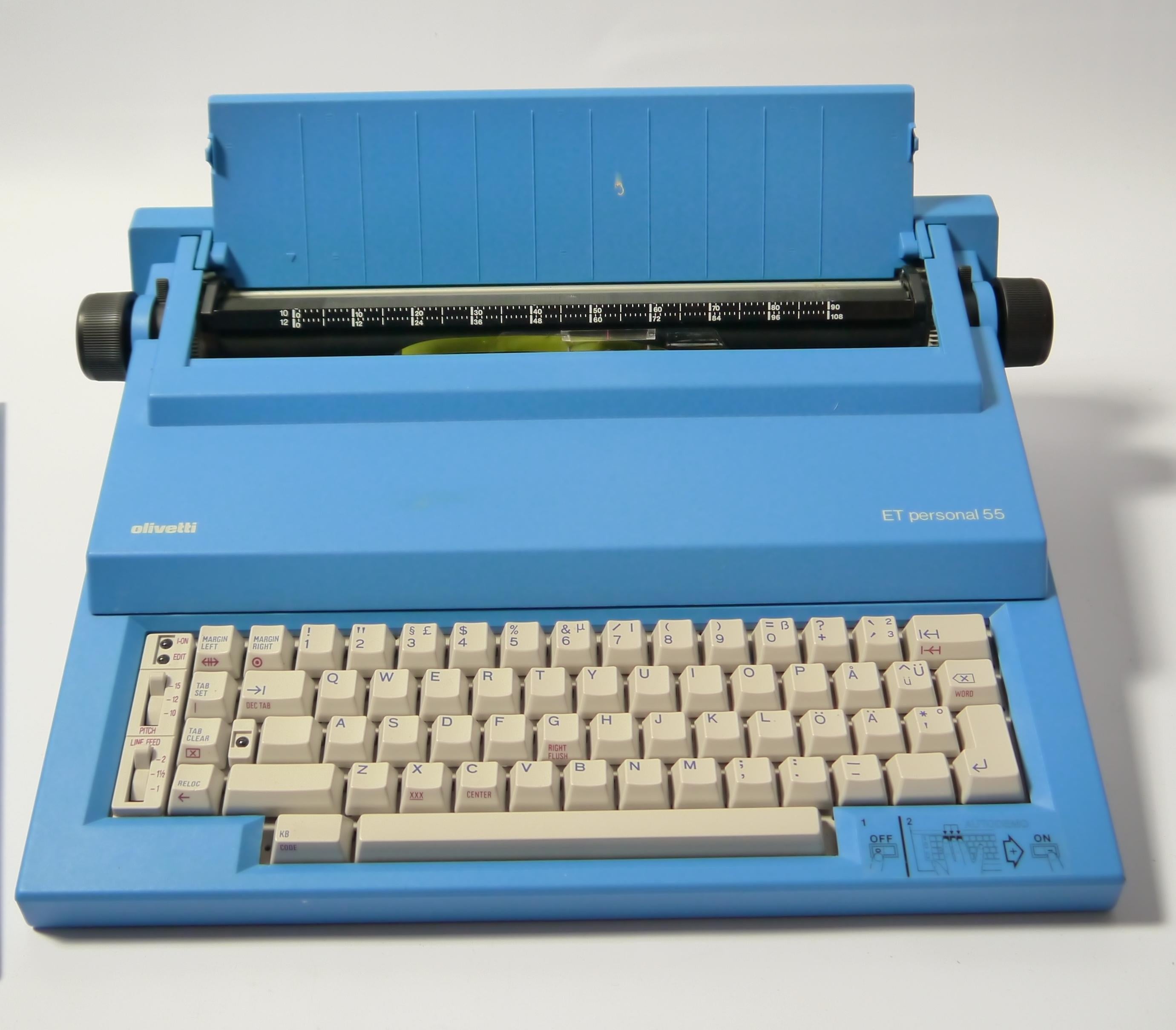 Portable electric typewriter model ET 55 designed by Mario Bellini in 1987, and produced by Olivetti. Typical 1980s Memphis influenced design and color. Complete and fully working (probably needs new ribbon) and comes with original box. The ET 55 is