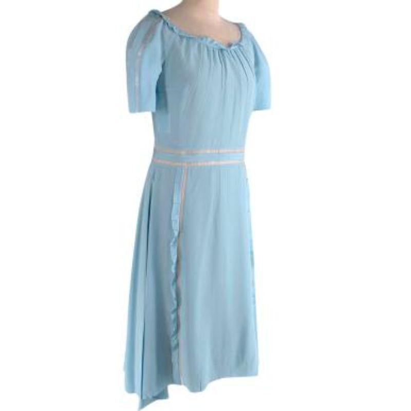 Prada Baby baby blue silk crepe & tulle cut-out dress
 
 
 
 - Light weight, fluid silk body 
 
 - Sheer panel detail 
 
 - Gathered collar and side panels 
 
 - Cap sleeves 
 
 - Nude slip dress 
 
 - Concealed back zip fastening 
 
 
 
 Material:
