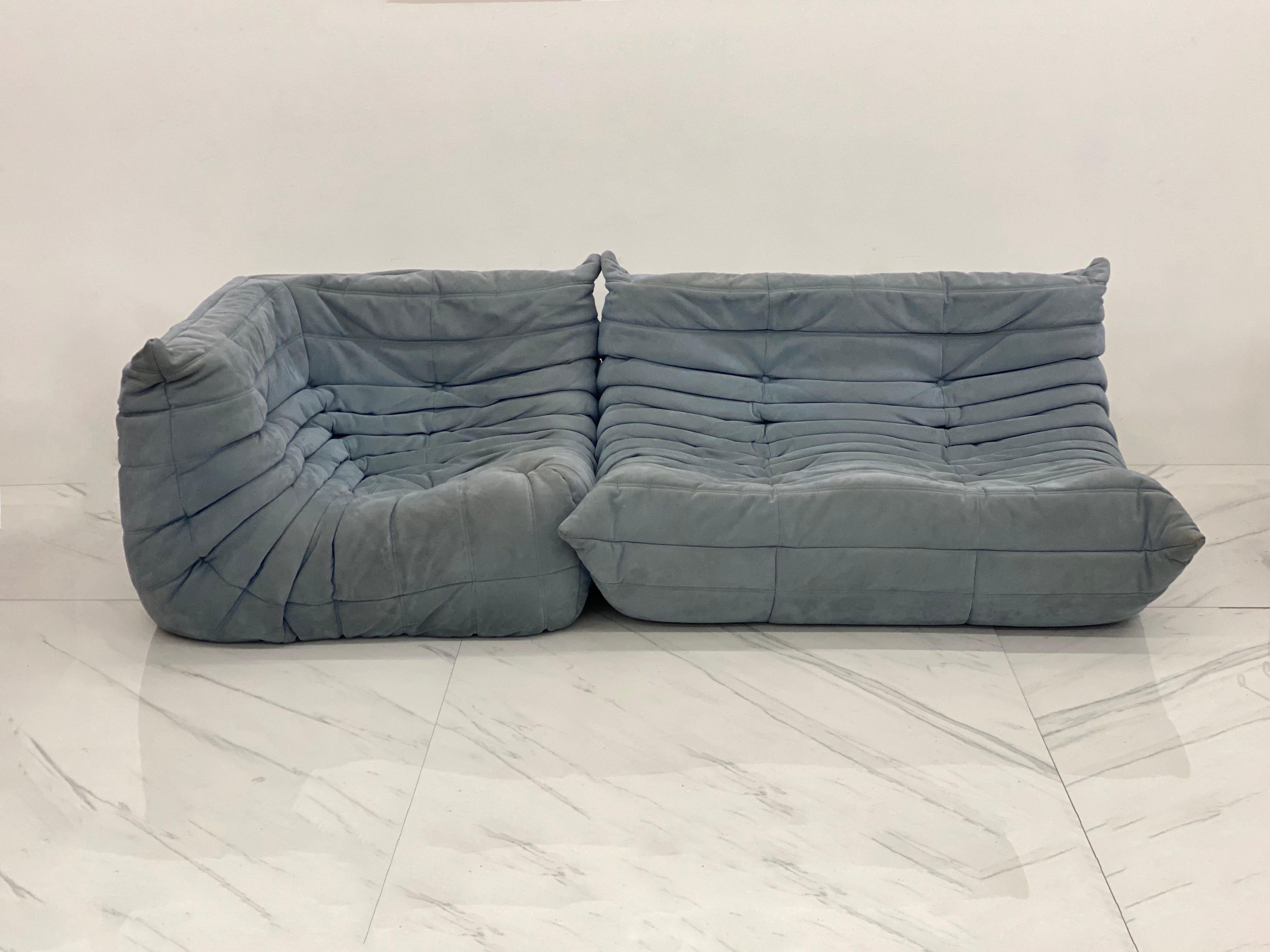 This incredible Togo sectional sofa in beautiful baby blue Alcantara suede was designed by Michel Ducaroy in 1973 for Ligne Roset, France. Signed with Ligne Roset labels. Timeless design make this Togo loveseat and corner seat combo by Michel