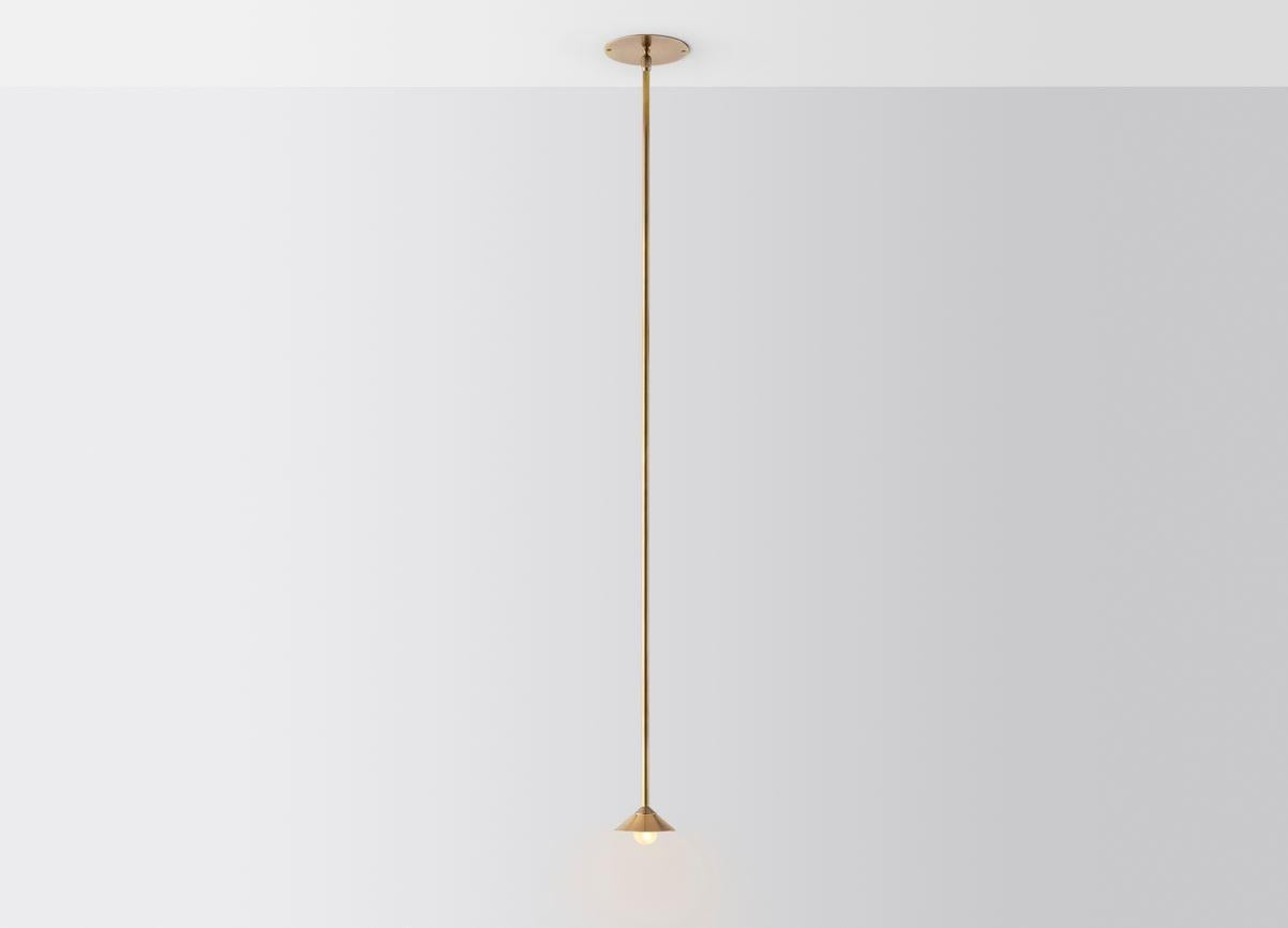 Baby drop pendant light by Volker Haug
Dimensions: Diameter 10.5 x H 40 cm 
Material: Brass. 
Finish: Polished, Aged, Brushed, Bronzed, Blackened, or Plated
Light: 12V G4 LED x 1
Power supply: : 110V-240V, 12V transformer supplied
Weight: