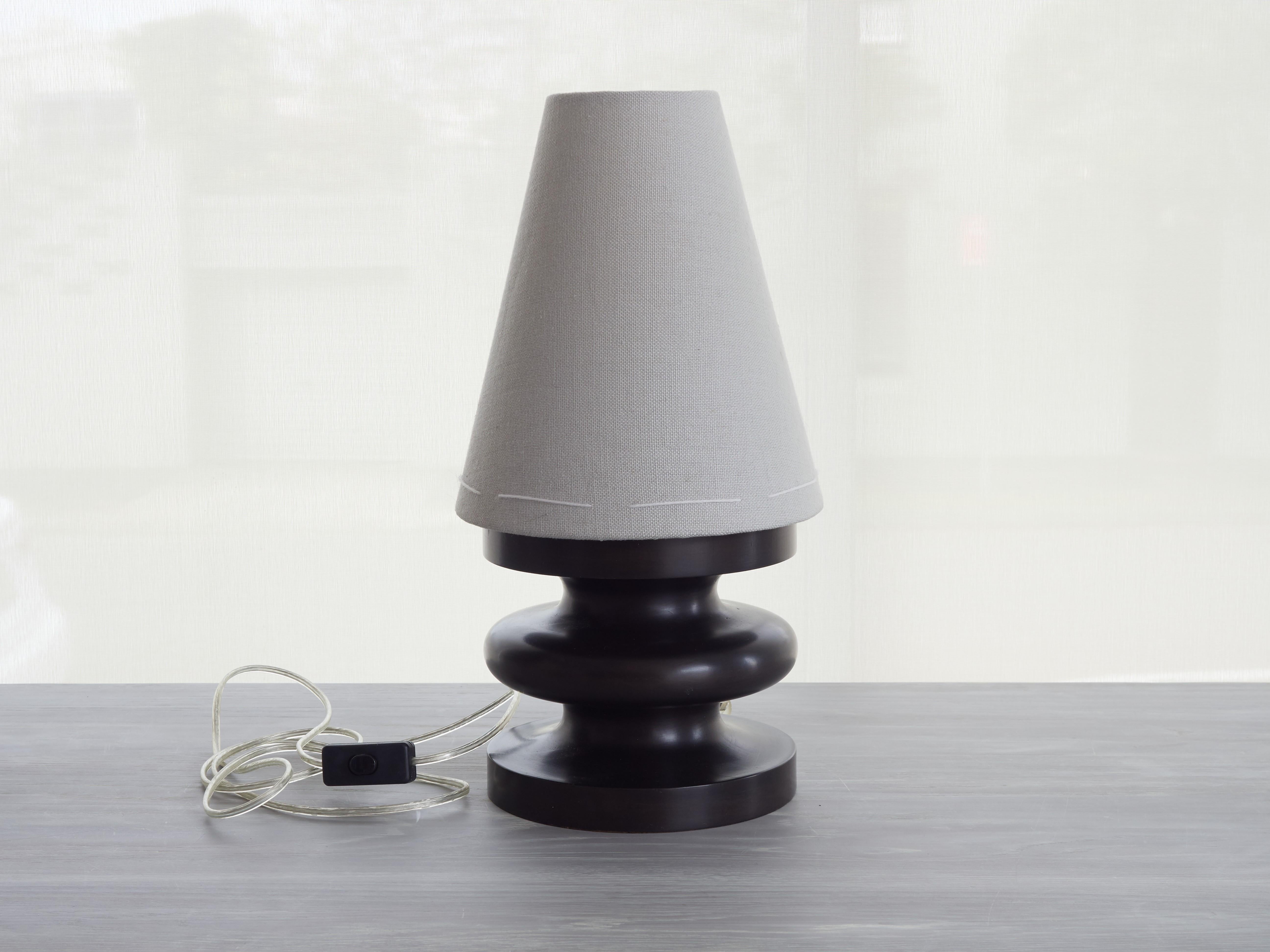 This original sculptural, truly artisanal small table lamp is a handmade, timeless example of 21st century organic modern design. Its artisanal, sensuous shape, reminiscent of Brancusi's minimal, totemic 20th century sculptures, is designed and made