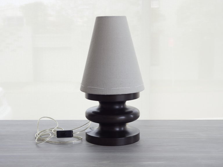 This original sculptural, small table lamp is a handmade, timeless example of 21st century organic modern design. Its artisanal, sensuous shape, reminiscent of Brancusi's minimal, totemic 20th century sculptures, is designed and made in Australia of