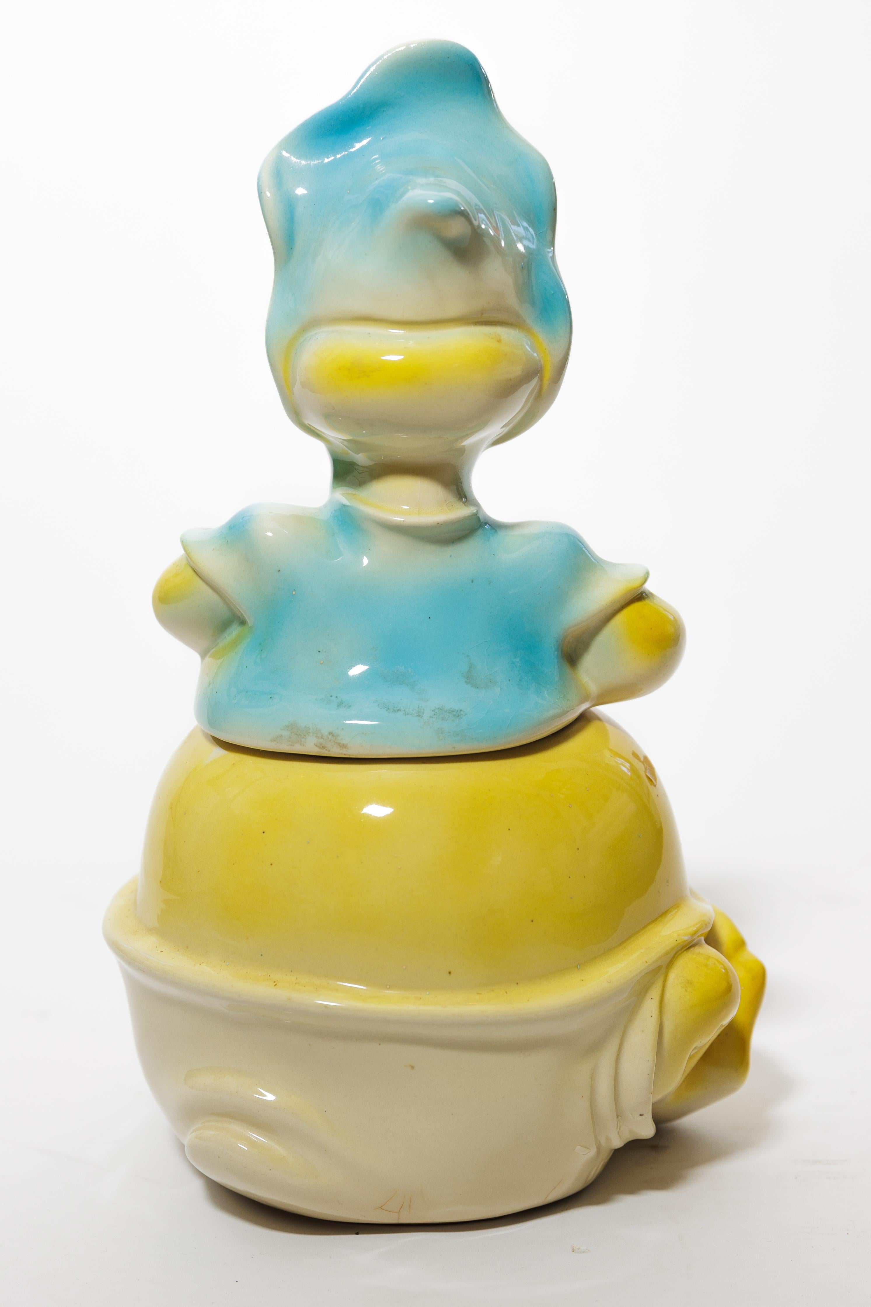 Baby Huey is a rare find in a cookie jar.  He was a famous animated
cartoon character.  Do you remember him?