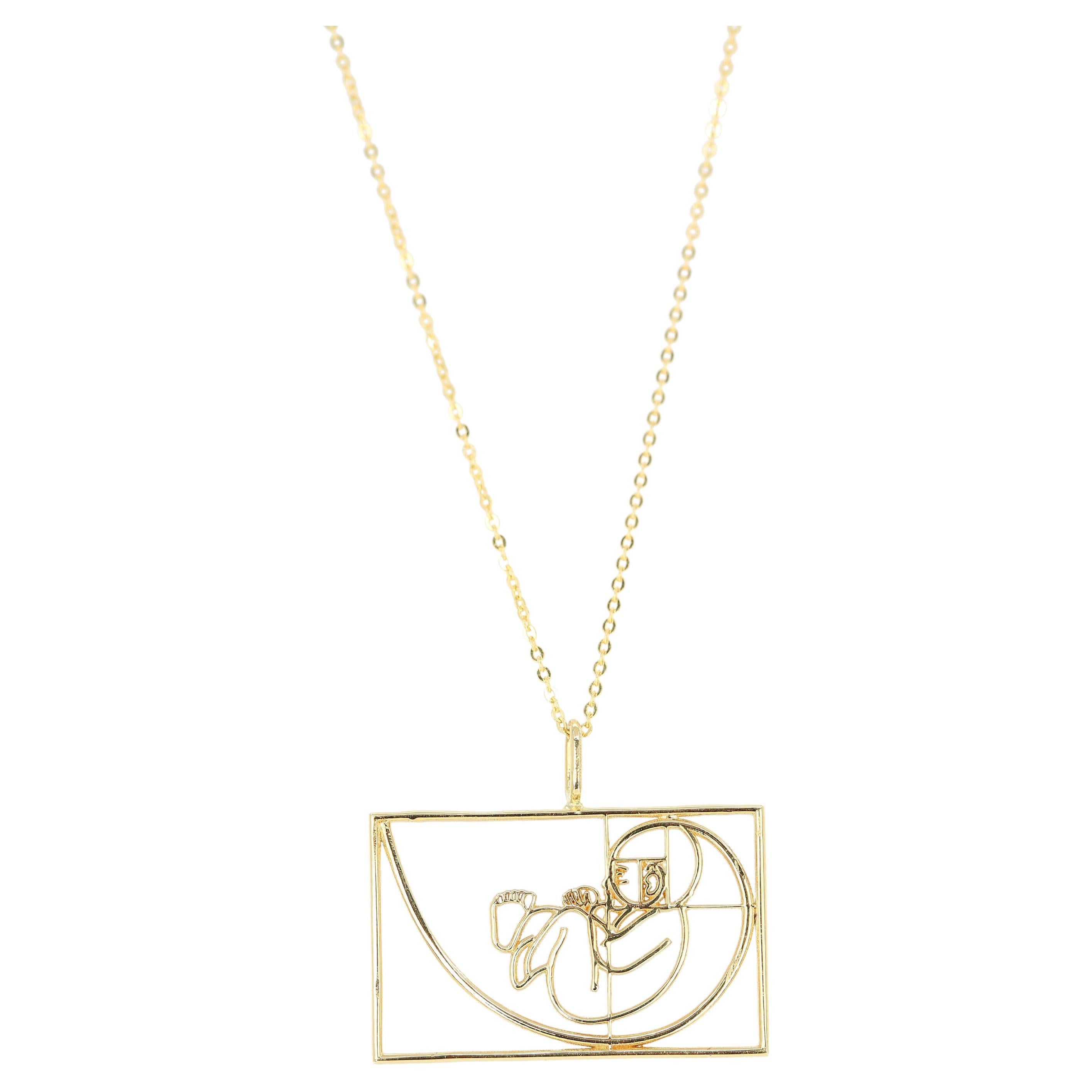 Baby in the womb Necklace with Pendant made of 14K Gold - Golden Ratio Necklace - Inspired by Leonardo Fibonacci - Professional Designer Necklace created by hands from every parts and every details. 

This necklace inspired by Leonardo Fibonacci's