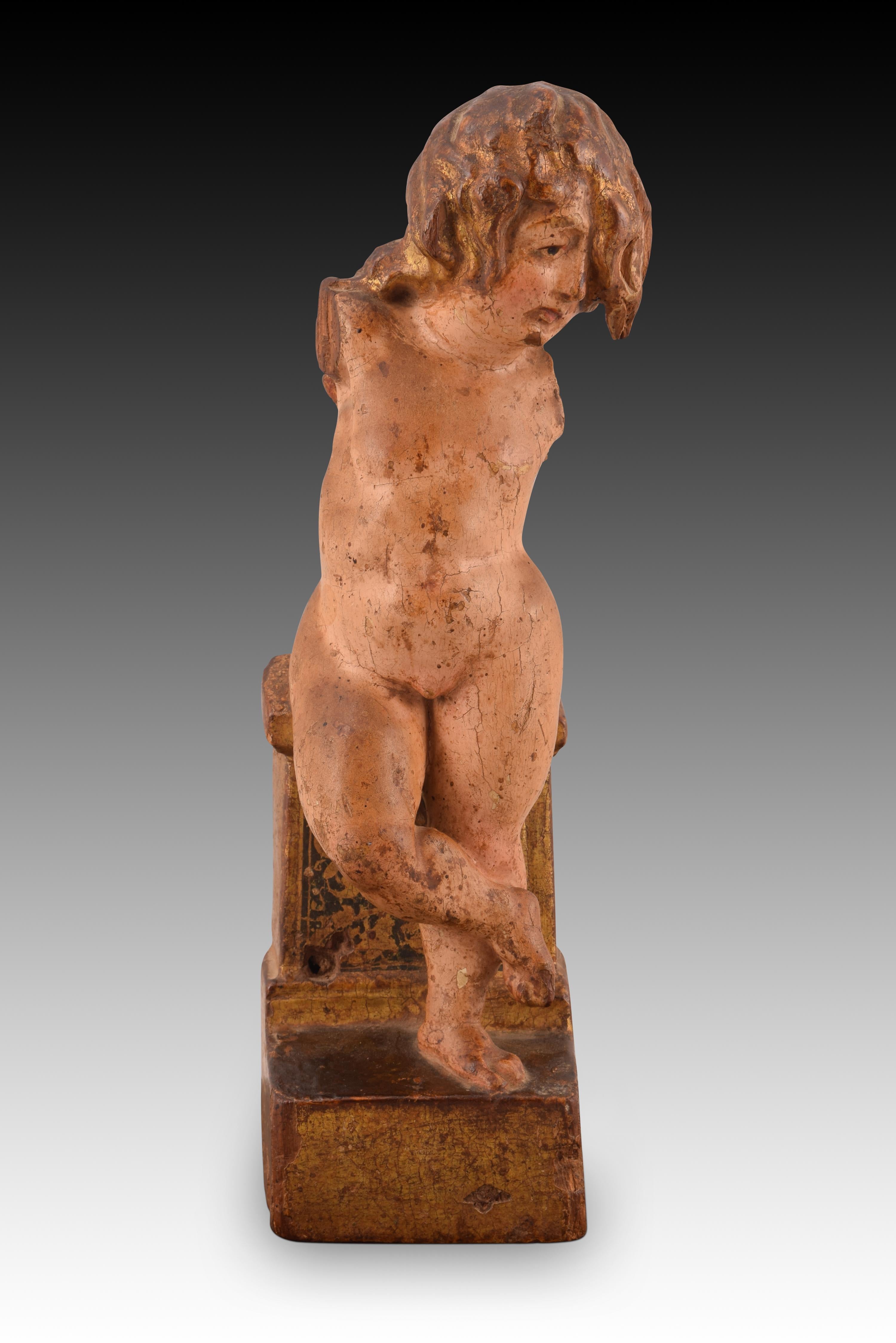 Baby Jesus or angel. Carved, polychrome and gilded wood. Spanish school, 16th century.
 It has faults. 
Figurative carving made of wood, polychrome and gilded, representing a naked child, with hair fallen over one eye and one leg crossed over the