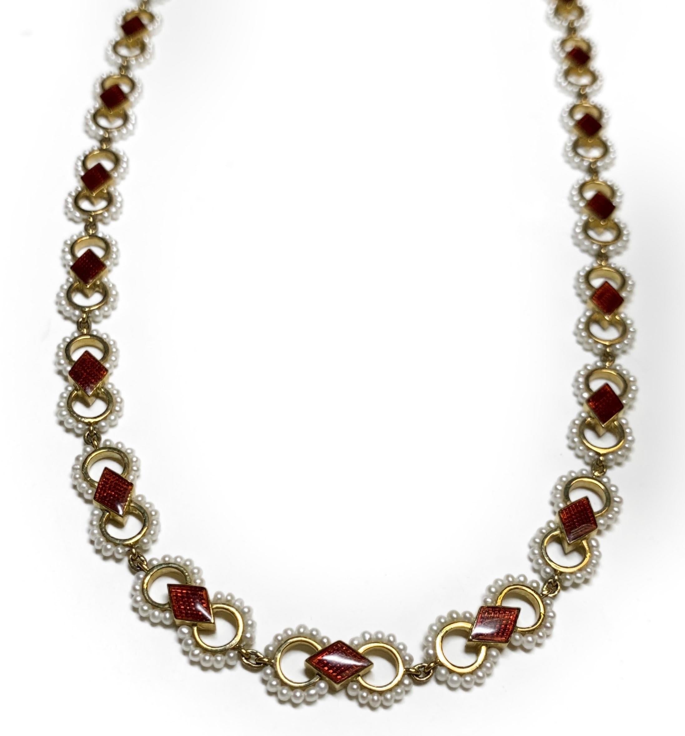 Seed Pearl and Red Enamel Necklace
18 Karat Yellow Gold
Pearls weighing 13.90 carats 