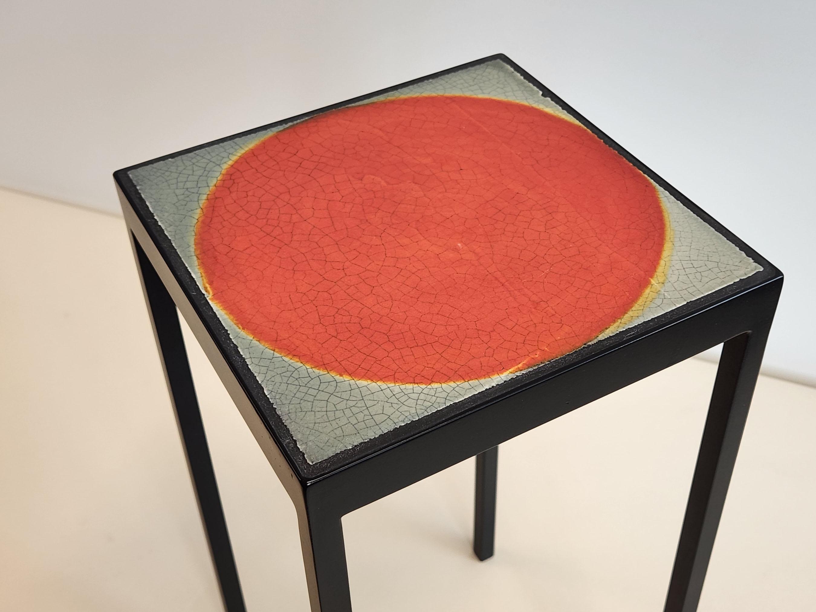 These side tables feature new painted steel frames and a vintage lava tile from Roger Capron. Made in 1970s, these tiles vary in color and texture, resulting from the hand glazed process.

Custom tables available upon request.- Client can pick the
