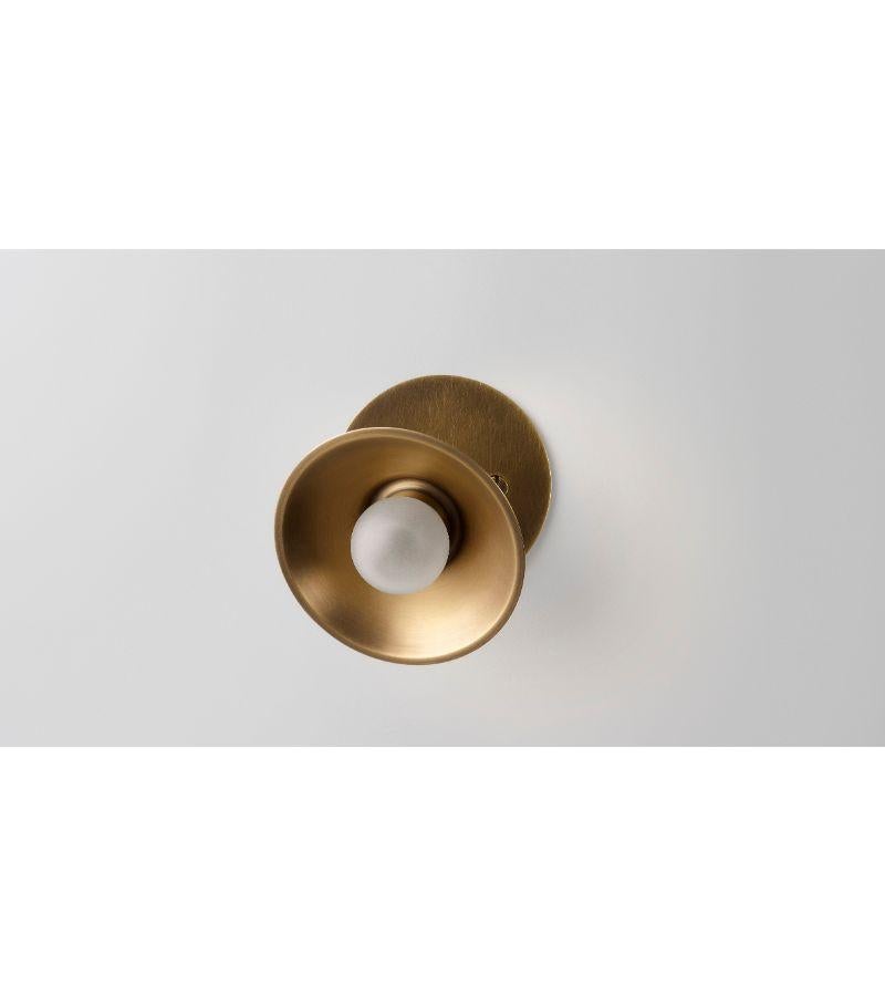 Baby Wall Swing Sconce by Volker Haug
Dimensions: Diameter 10.5 x Height 9.5 cm 
Material: Brass. 
Finish: Polished, aged, brushed, bronzed, blackened, or plated
Light: G4 - 12V, LED x 1
Power supply: 110V-240V, 12V transformer