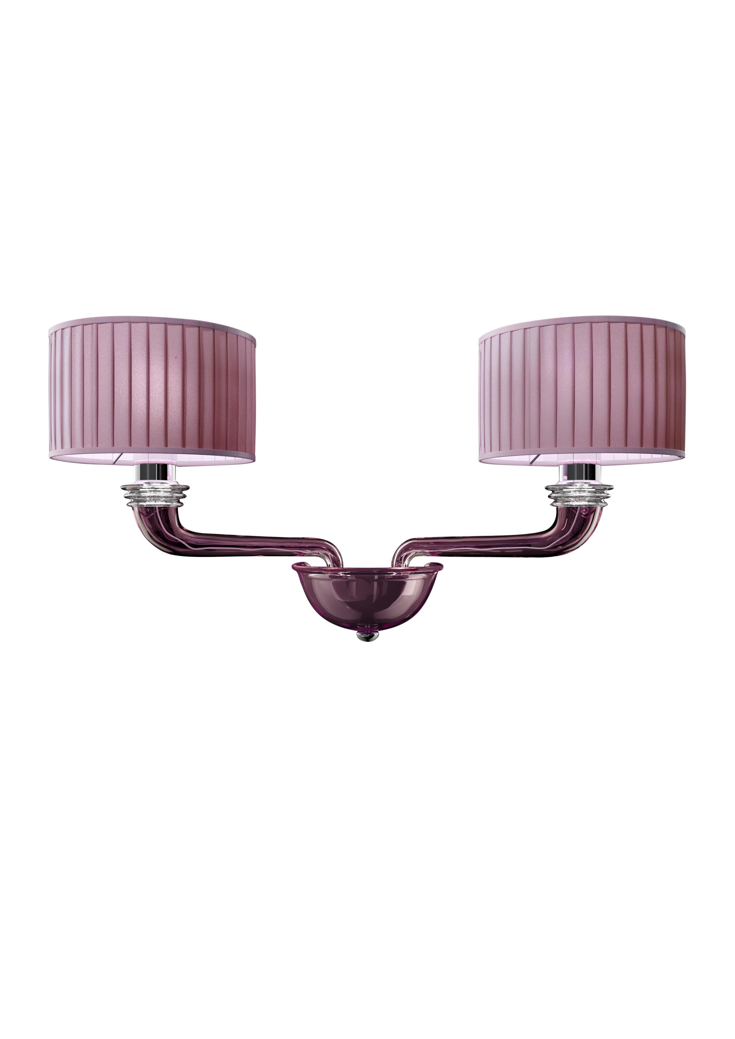 Here you are shown the Babylon 5599 02 Wall Sconce in Dark Chrome Finishing and White Shade, originally designed in 2008. The Babylon is a linear, elegant light, with straight arms and pleated lampshades created entirely in fabric without internal