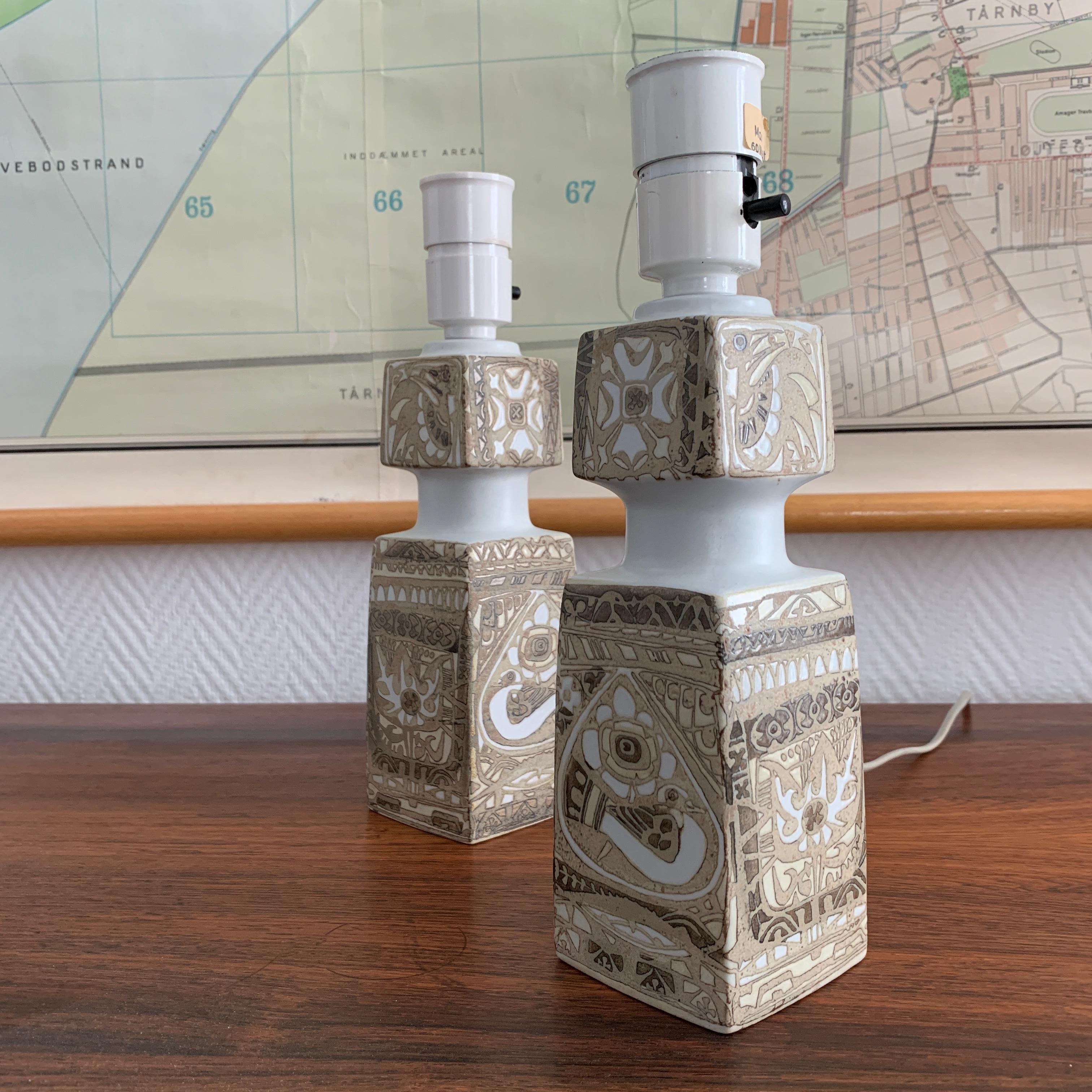 Pair of midcentury table lamps from the Royal Copenhagen BACA Series. This is the most compact model suitable for window frame. Hand decorated stoneware. Part of the Baca series trays and vases in different sizes and shapes. Designer Nils Thorsson