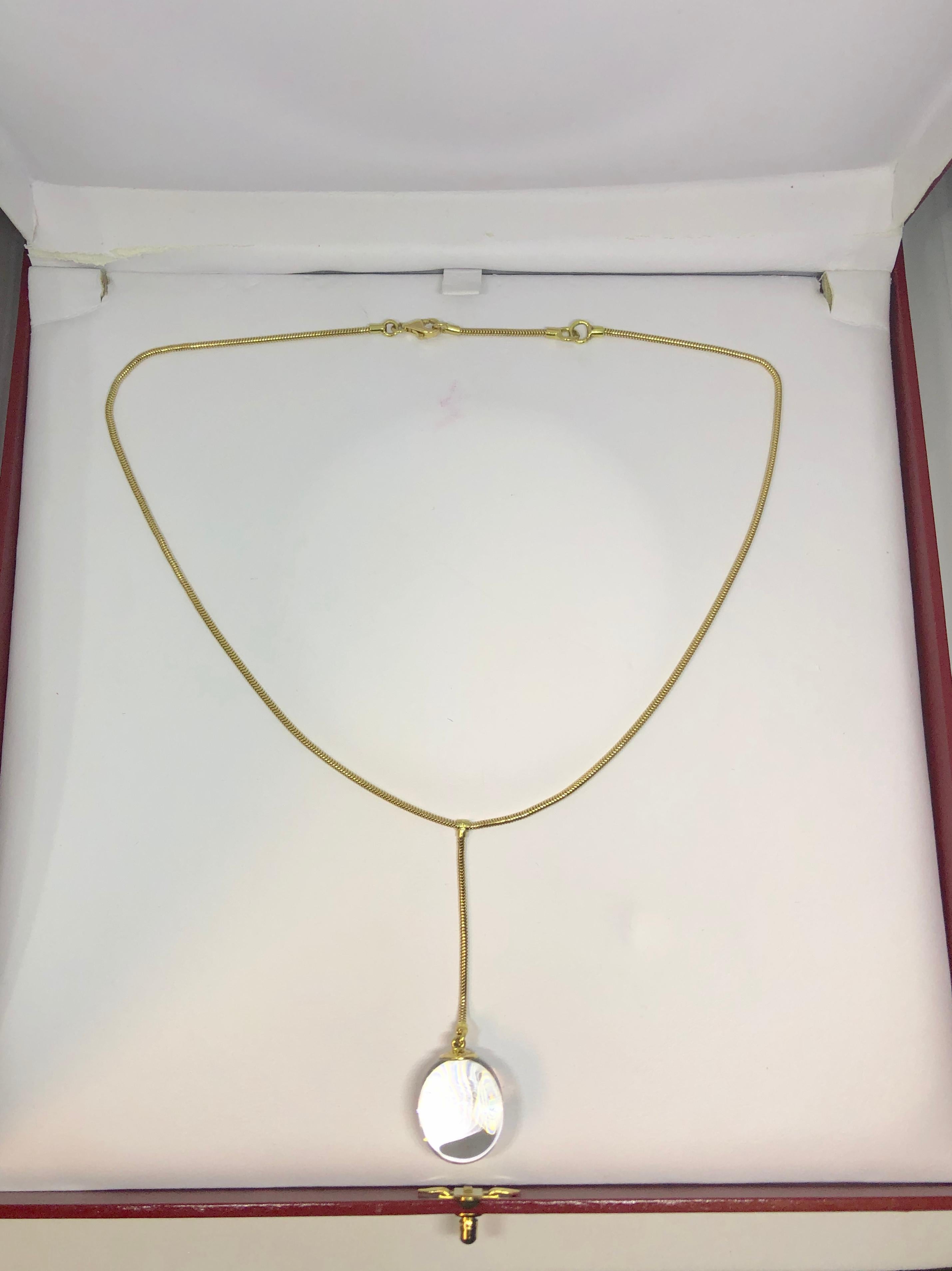 Baccarat 18 karat crystal modern 1990's  lariat necklace. This original Baccarat piece is created in 18 karat yellow gold, weight = 12.7 grams, 8.1 dwt. Of course this piece is adorned with the most desirable French Baccarat crystal, the crystal
