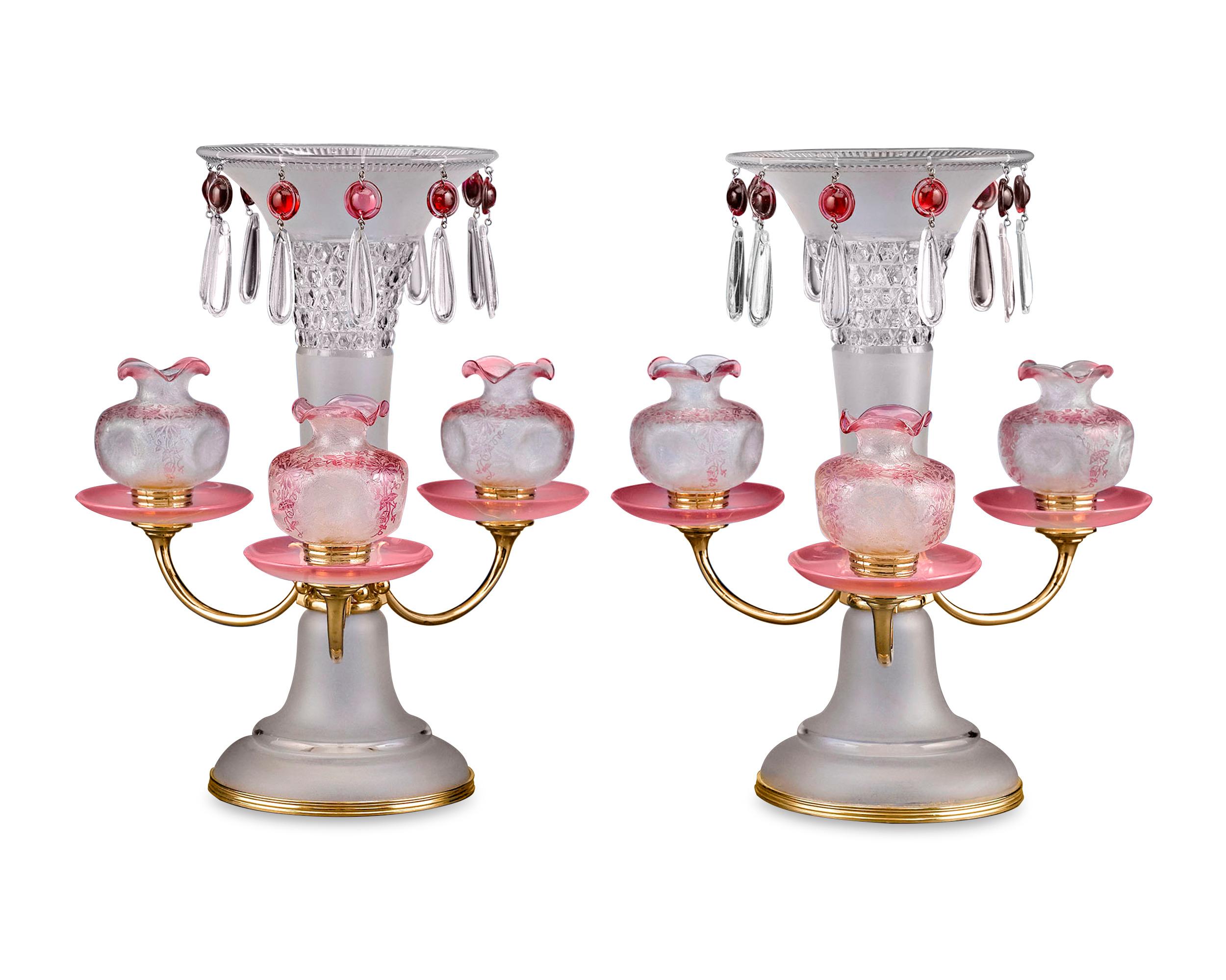 This extraordinary and rare pair of centerpieces beautifully showcase the artistry of Baccarat crystal. Art Nouveau in style, the centerpieces feature large vases of frosted glass with masterfully cut designs at their flared peaks. Teardrop glass
