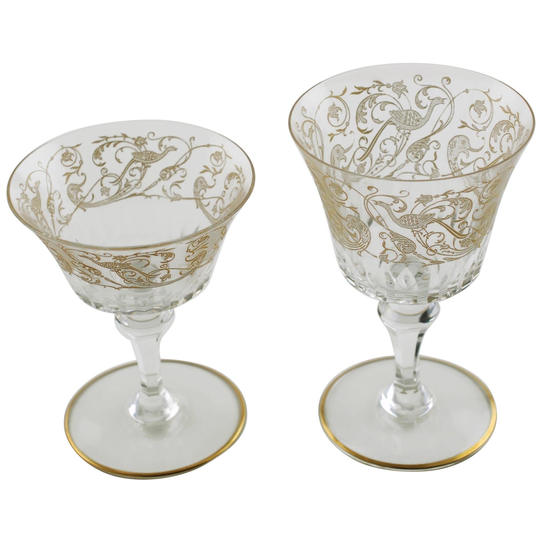 This set of 16 Baccarat French crystal glasses have been decorated in the lovely Bergame pattern. Baccarat's ornate Bergame is a variation of the Parme pattern which dates to 1850. Bergame features an Empire Revival motif consisting of etched Birds