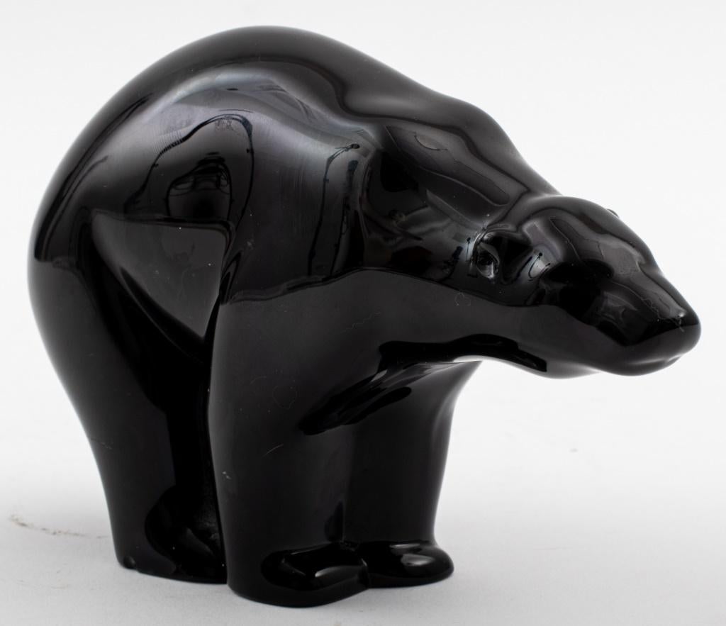 Baccarat black glass polar bear, sleekly modeled, the polished glass bear on all four paws, etched to underside or front left paw with signature 