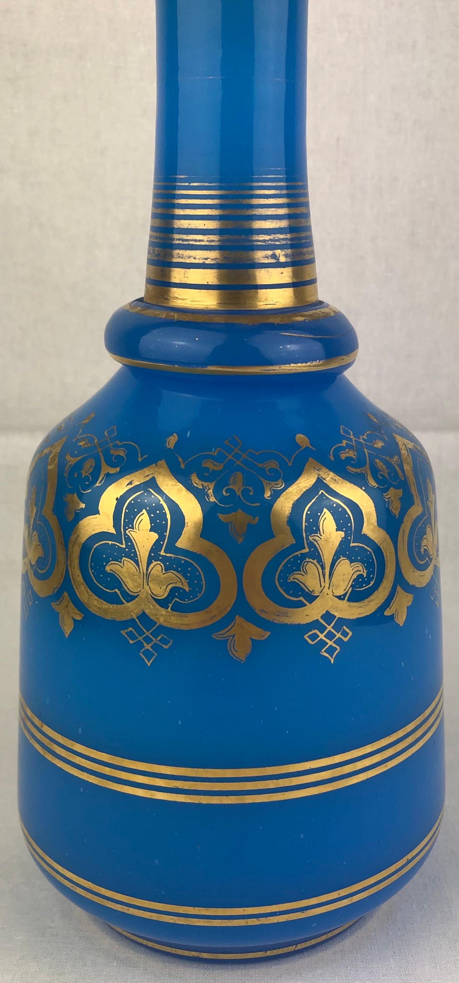 A large stunning French blue opaline glass bubble bath bottle dating from the 19th century. 
Unsigned Baccarat piece. 

Very attractive with vibrant colors. Overall good condition with some minor fading from use. 
The bouchon or top had a crack
