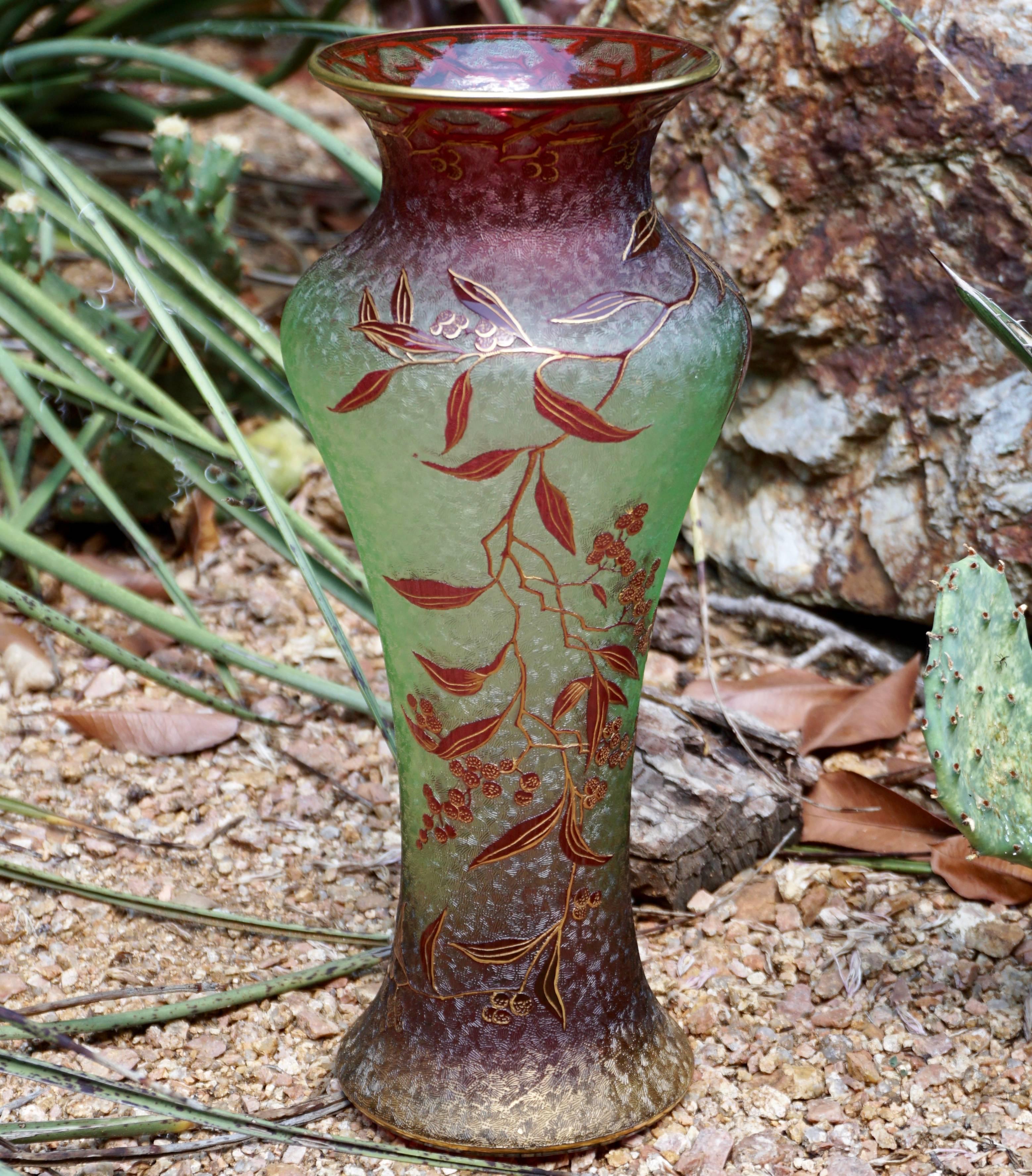 A rare and important Art Nouveau Baccarat vase, circa 1910, this art glass is multi layered with light green and cranberry red on clear glass that is entirely textured in ice etching with carved branches with leaves and raspberries. Absolutely