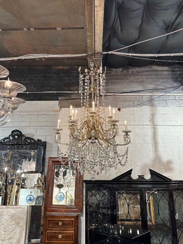 19th century French Baccarat crystal and gilt bronze 10 arm chandelier. Circa 1870. The chandelier has been professionally rewired, comes with matching chain and canopy. It is ready to hang!