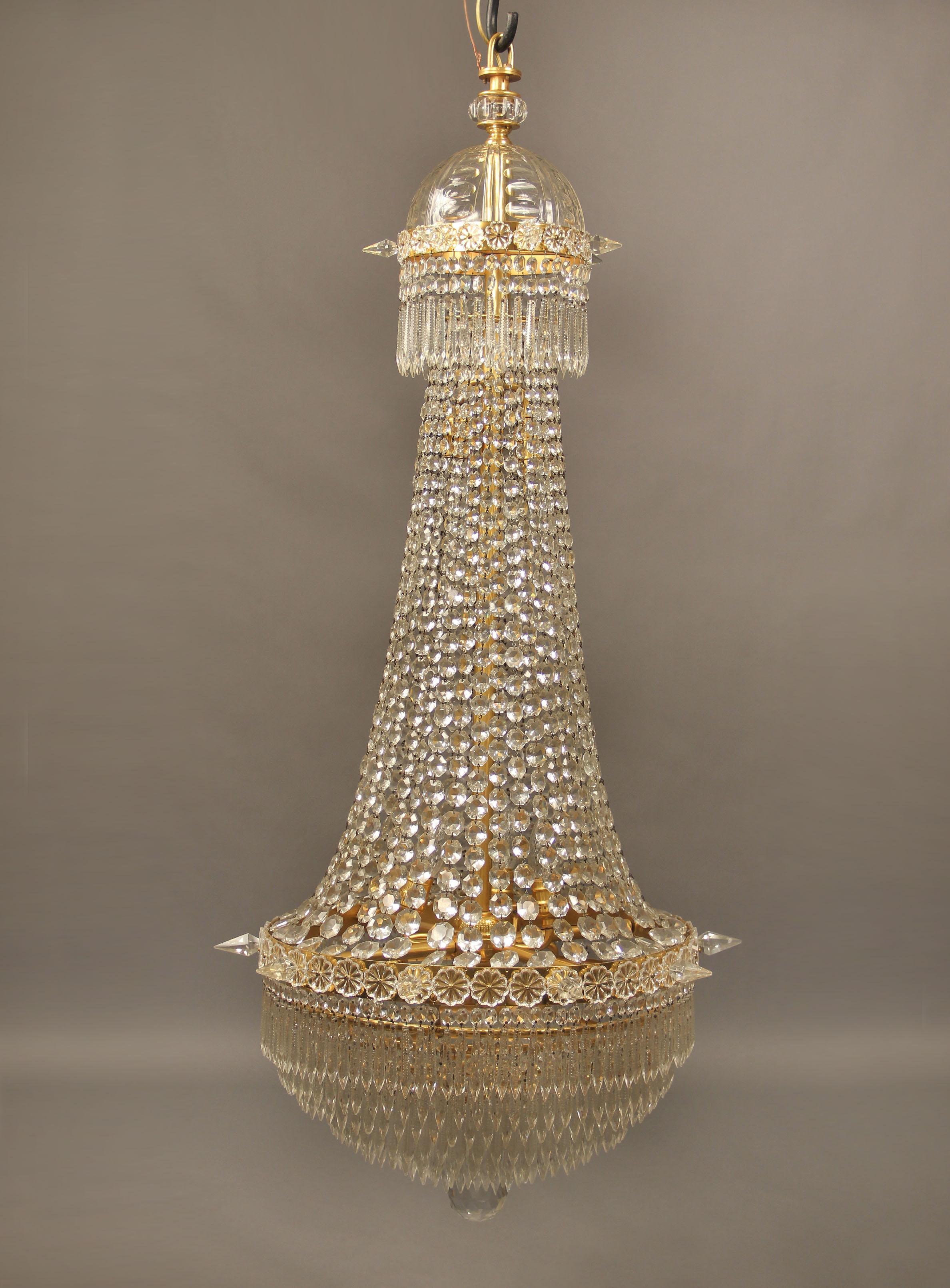 A Beautiful Late 19th Century Gilt Bronze Beaded Eight Light Drop Crystal Chandelier

With a fine crystal dome on top and layered drop crystal ending in a beautiful cut crystal ball.

If you are looking for a chandelier, a lantern or sets of
