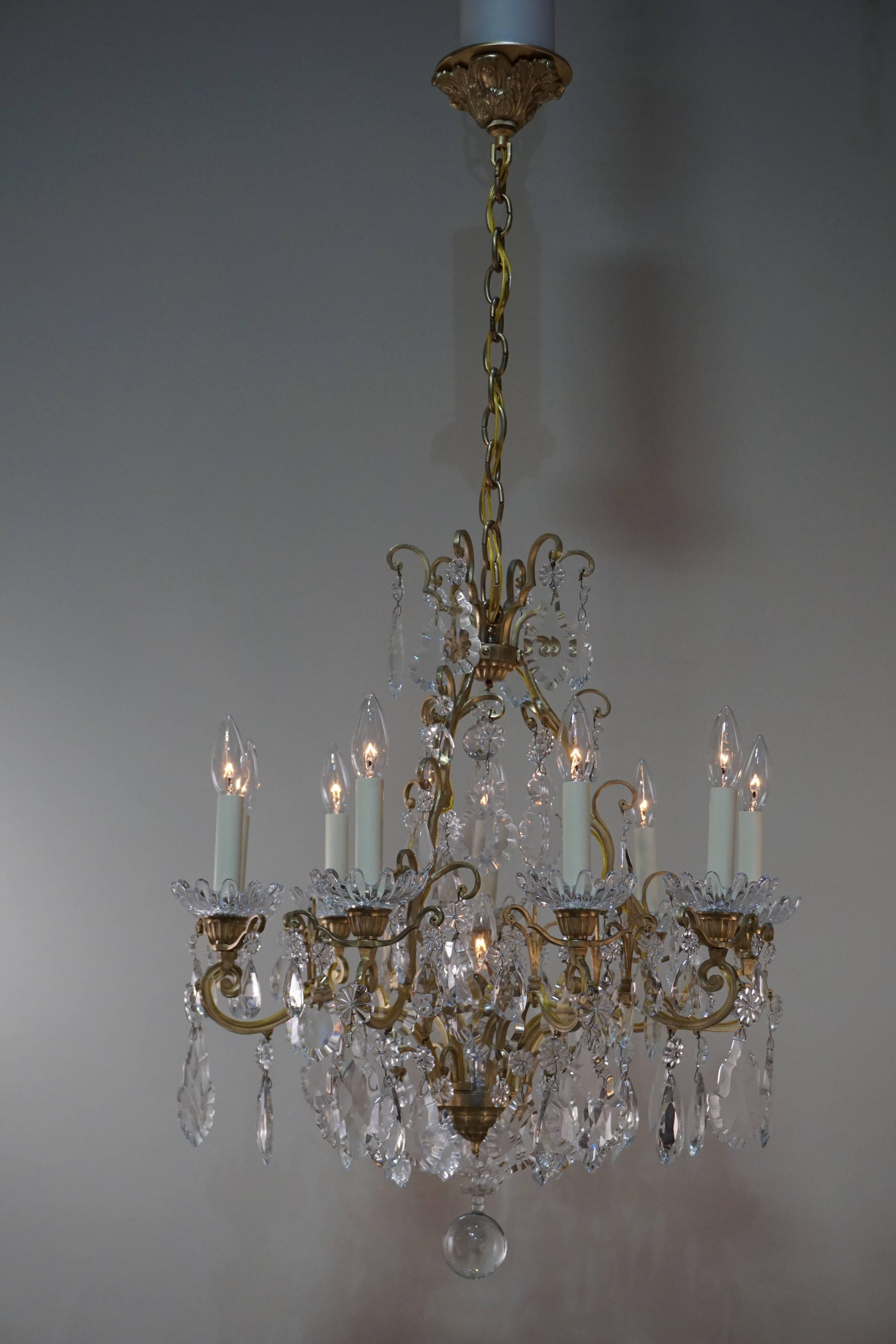Elegant ten-light signed crystal chandelier with beautiful bronze frame work by Baccarat.
Can be fully installed with total of 30