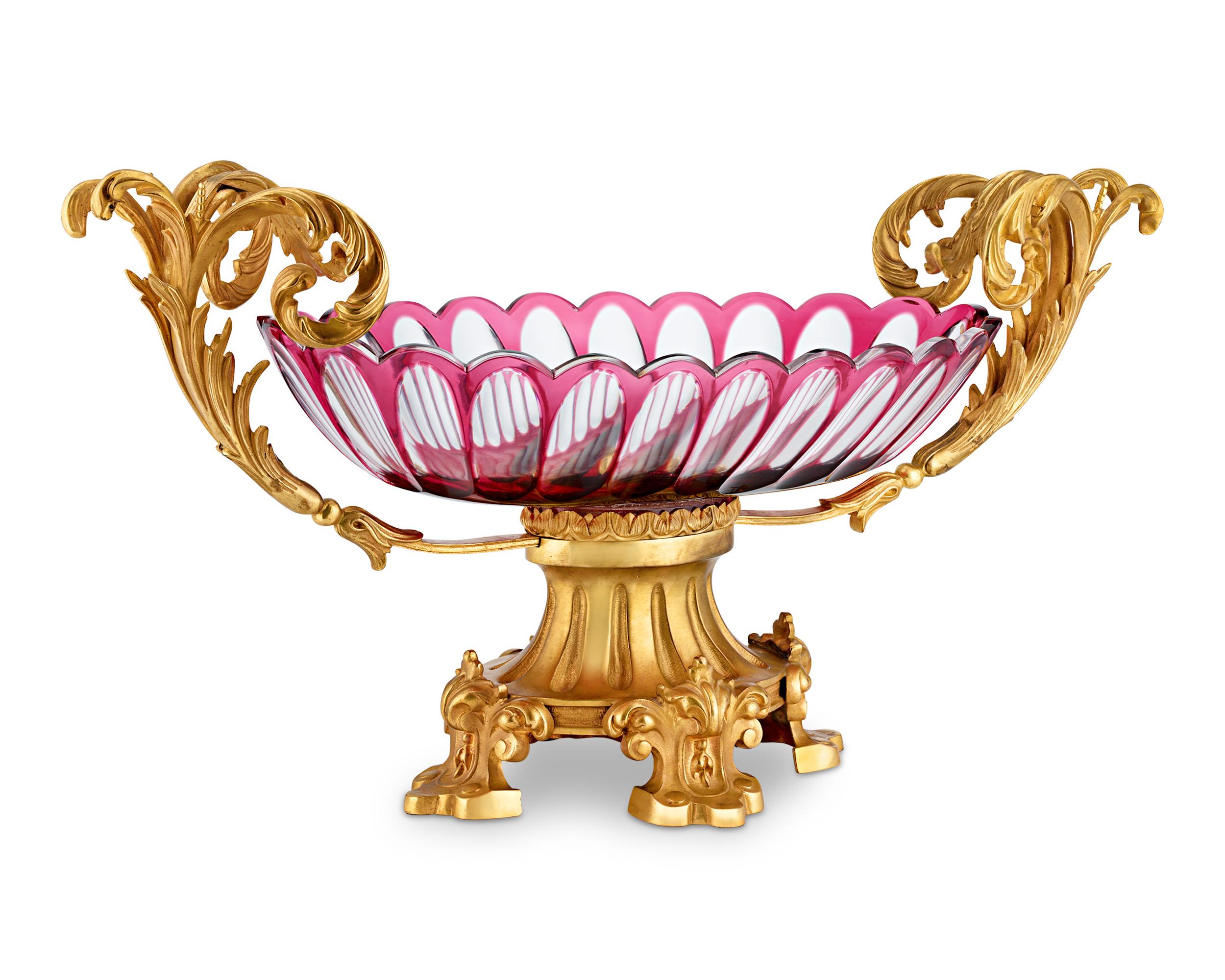 Luxurious doré bronze cradles the finest Baccarat crystal in this beautiful French Second Empire compote centerpiece. This magnificent vessel reflects the elaborate Louis XV style that Napoleon III and his wife, the stylish Empress Eugénie, adored.
