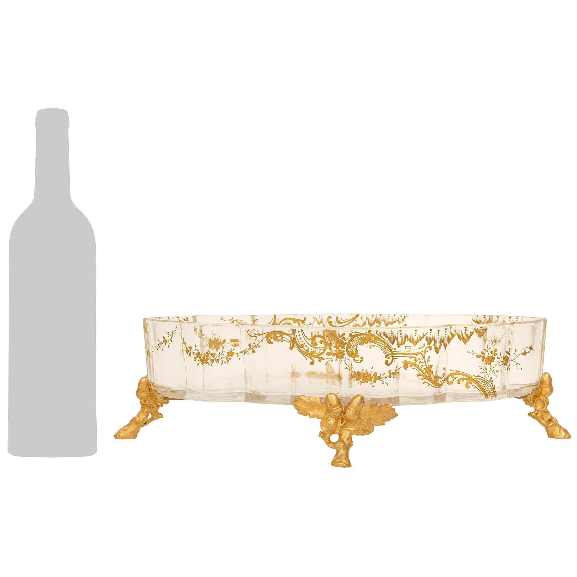 An exceptional and high quality French 19th century Louis XV st. Baccarat Crystal and Ormolu centerpiece, stamped Baccarat. The centerpiece is raised on four Ormolu branch designed feet decorated with richly chased acanthus leaves and acorns in a