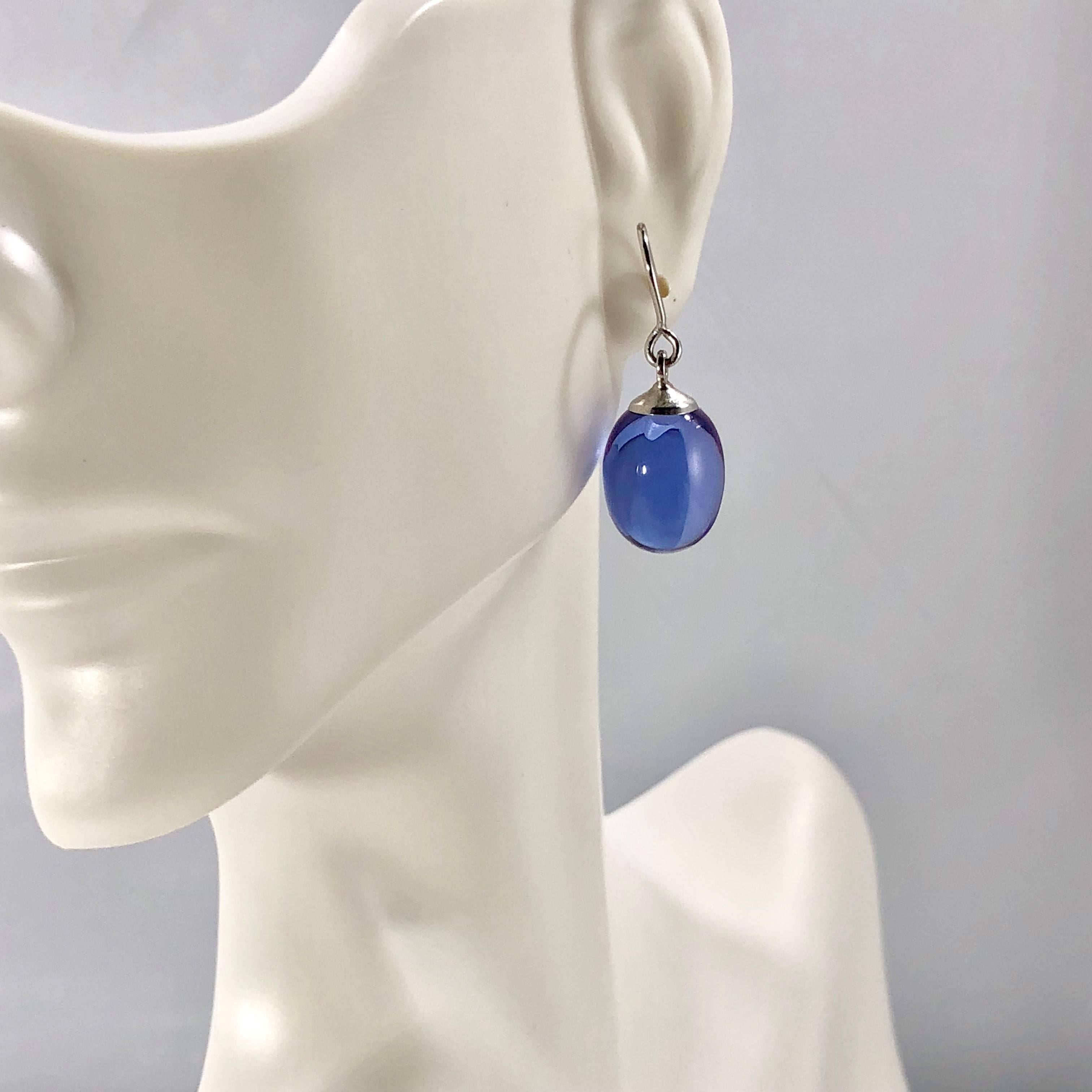 Baccarat crystal and sterling silver blue iridescent drop earrings. Baccarat French luxury brand and world leader in fine crystal authentic drop earrings. Created in a most beautiful iridescent Blue crystal, bright polished, oval drop shape for cut.