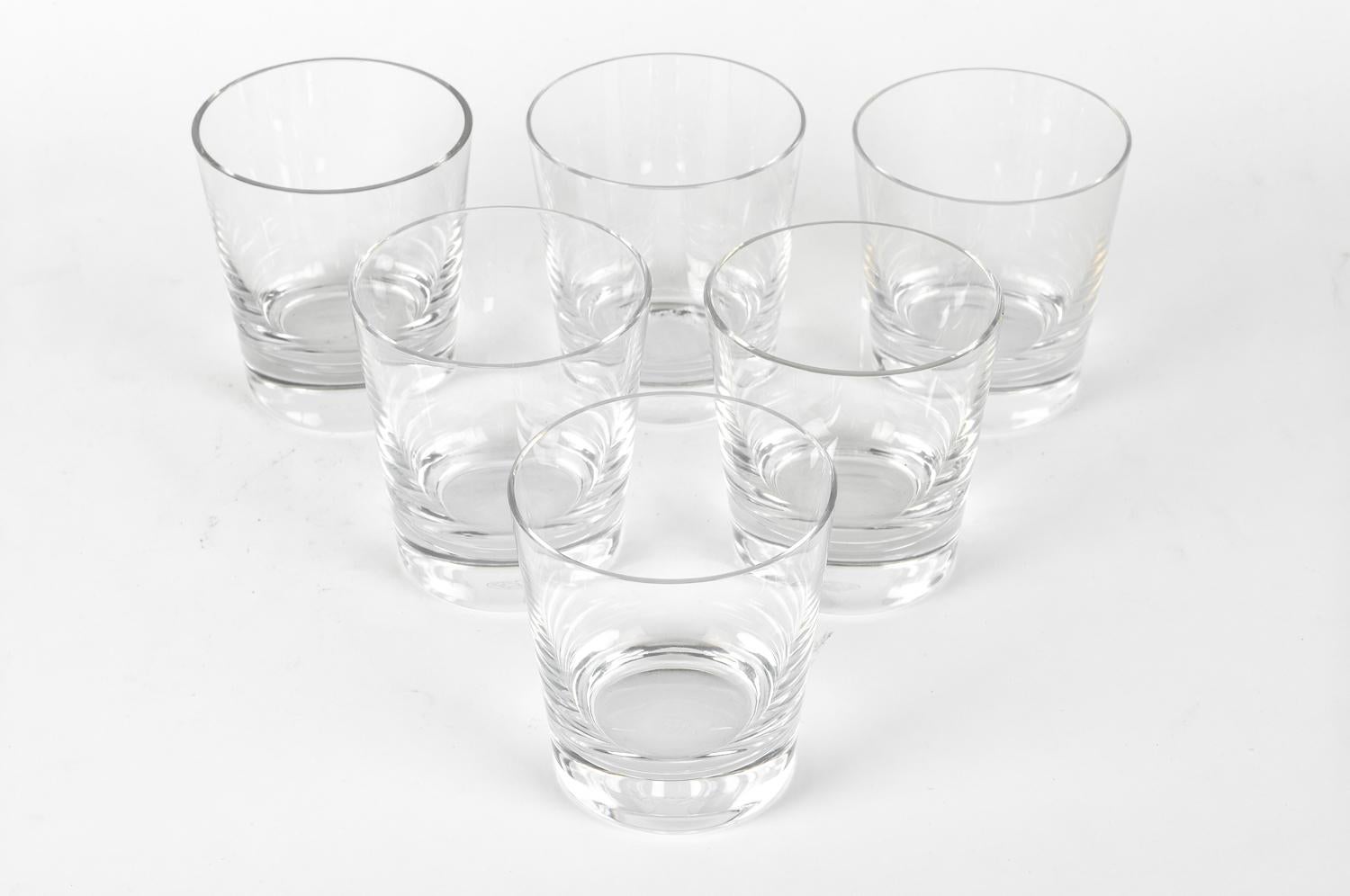 Baccarat crystal Art Deco style barware whiskey or scotch glassware set of six pieces. Each whiskey glass is in excellent condition, Maker's mark undersigned. Each glass measure 4 inches tall X 3.5 inches diameter.

 