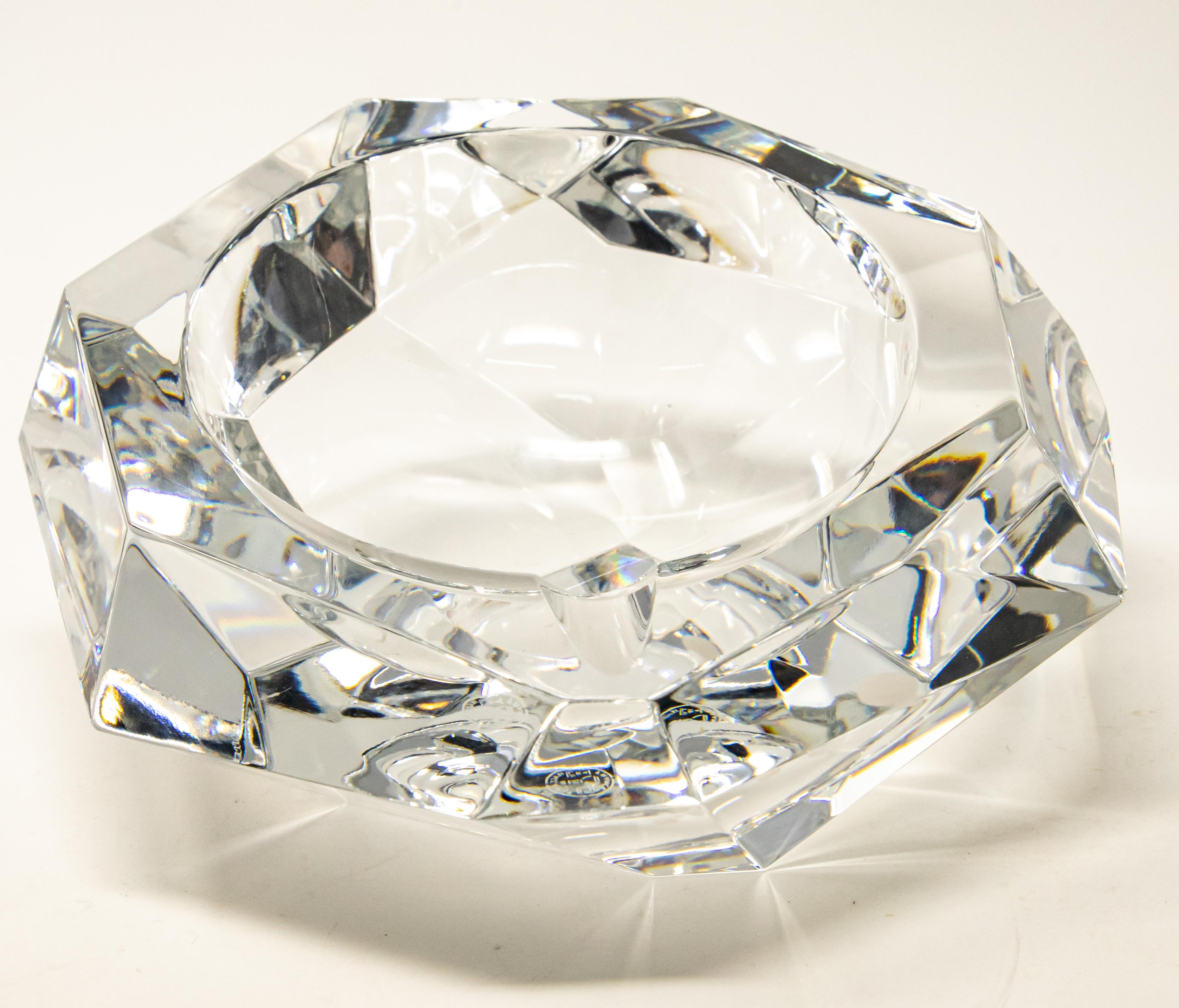 Offering this gorgeous crystal ashtray by Baccarat. Cut on many different angles this one shines and dazzles. Marked on the bottom Baccarat.