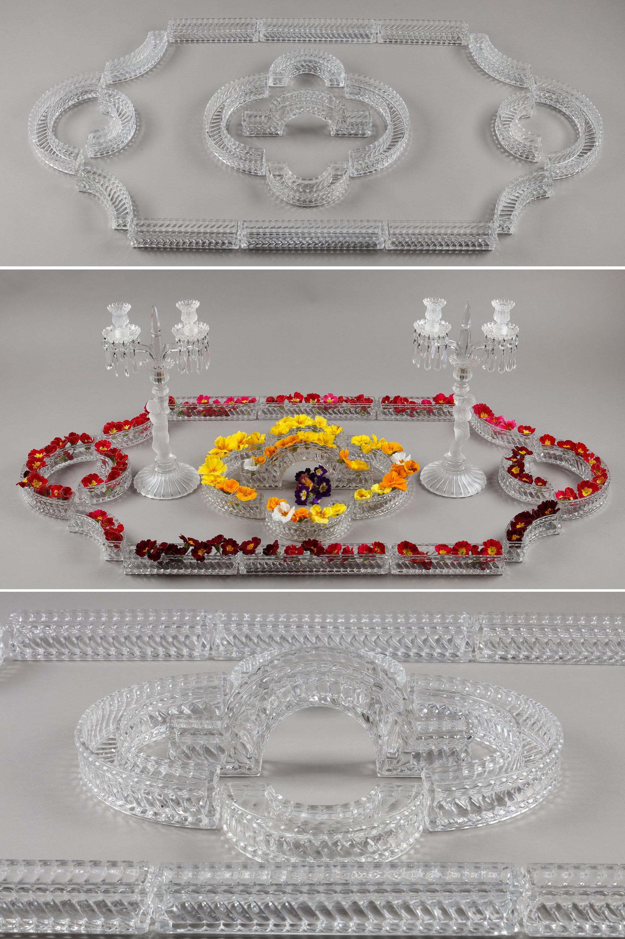 Baccarat table runner in molded crystal composed of 19 elements of different shapes. All the elements are signed Baccarat on the underside. They can be arranged in a multitude of ways to suit your tastes and will make the perfect table decoration