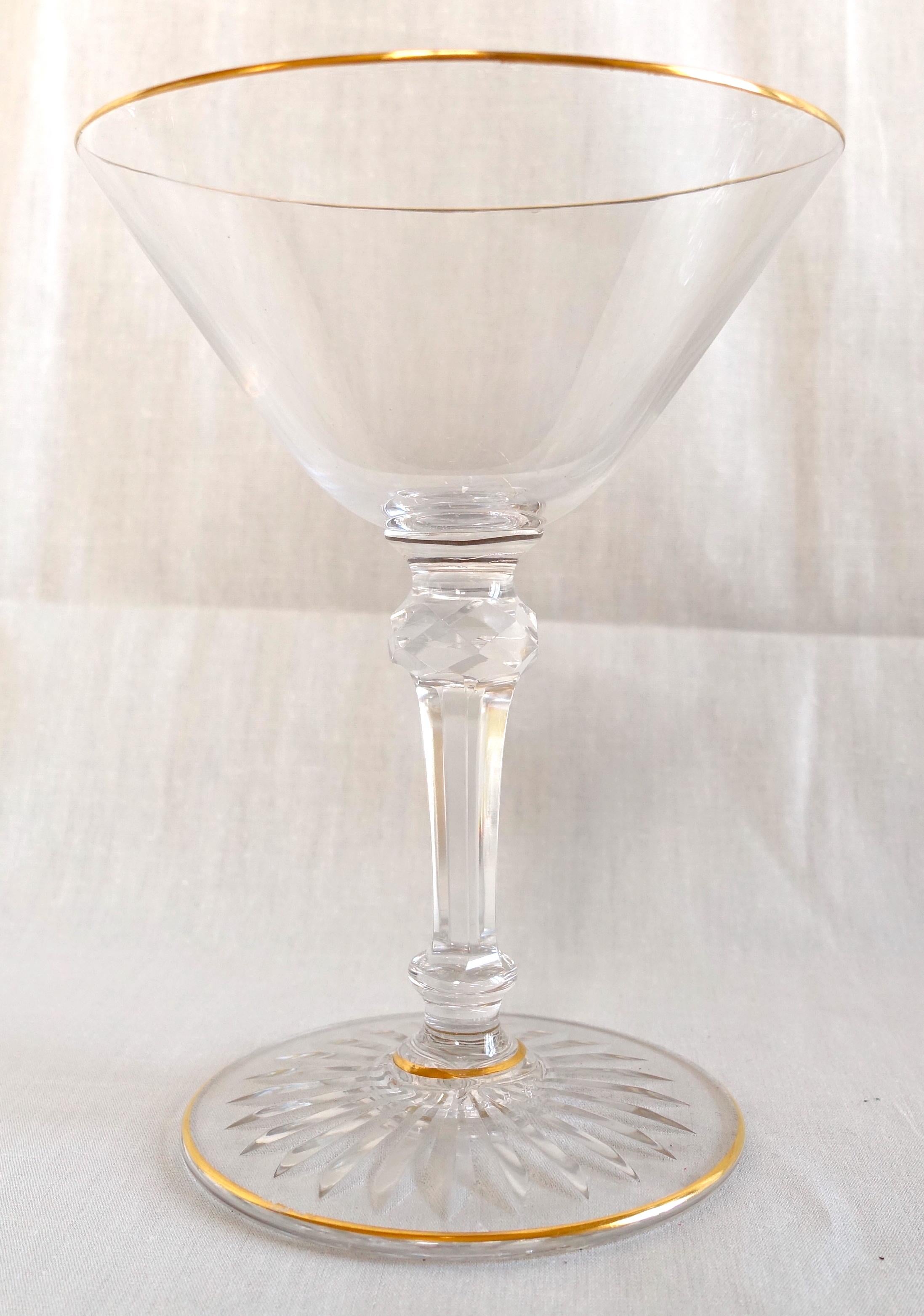 Baccarat crystal Champagne glass, early 20th century production circa 1900 - 1910. Elegant cut crystal model, star-shaped cut under the base, sophisticated cut foot, fine gold gilt on the edges.
Our glass is an antique production : it is not signed,