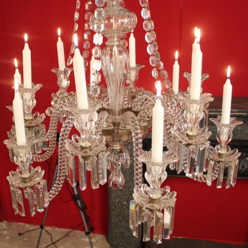 Baccarat crystal chandelier in very good condition (minimal signs of wear and use), 19th century with 12 lights, candle lighting the arms are full twisted, fluted baluster, foliated bobeches
a small mark on a bobeches.